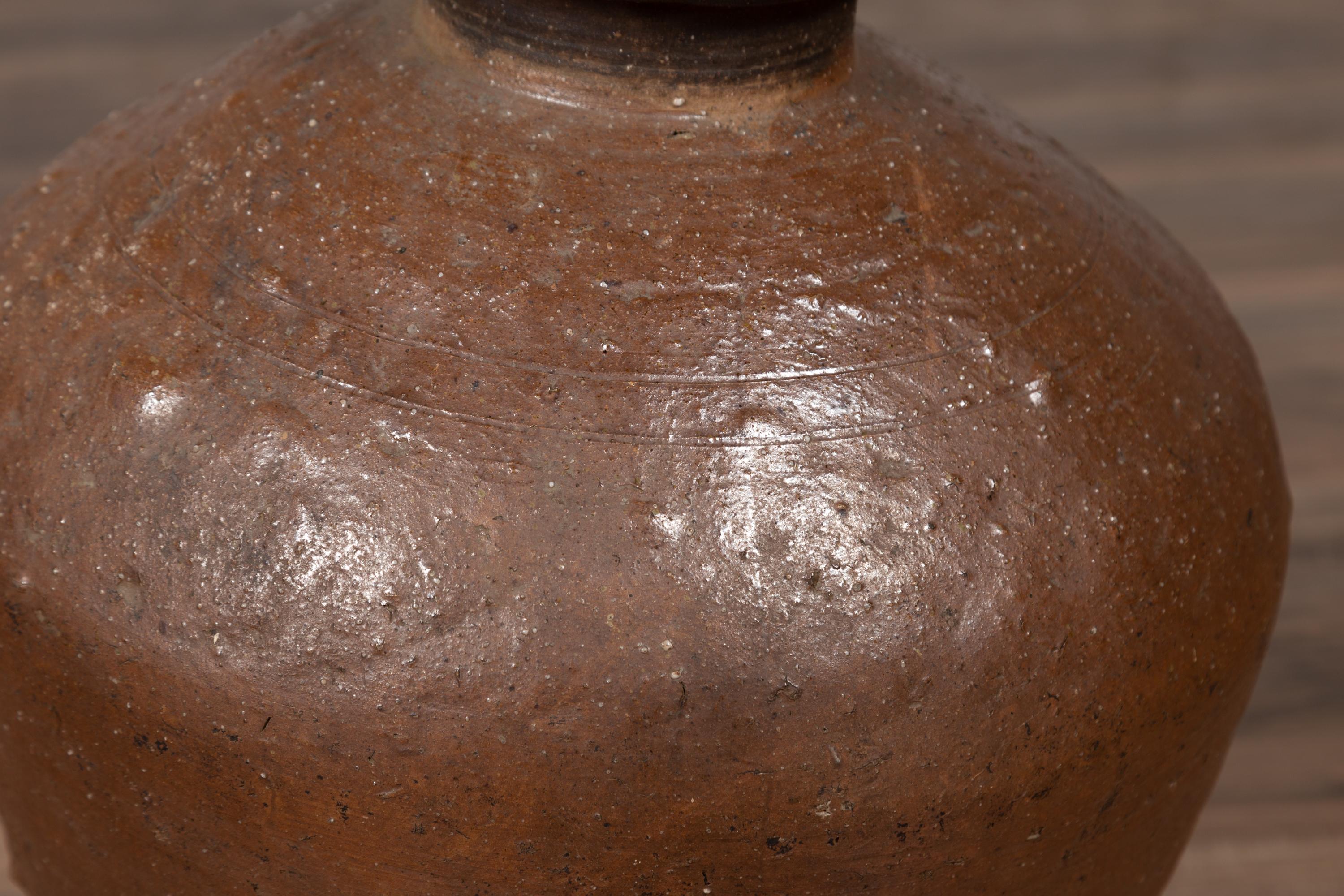 Antique Japanese Brown Oil Jar with Weathered Appearance and Irregular Shape In Fair Condition For Sale In Yonkers, NY