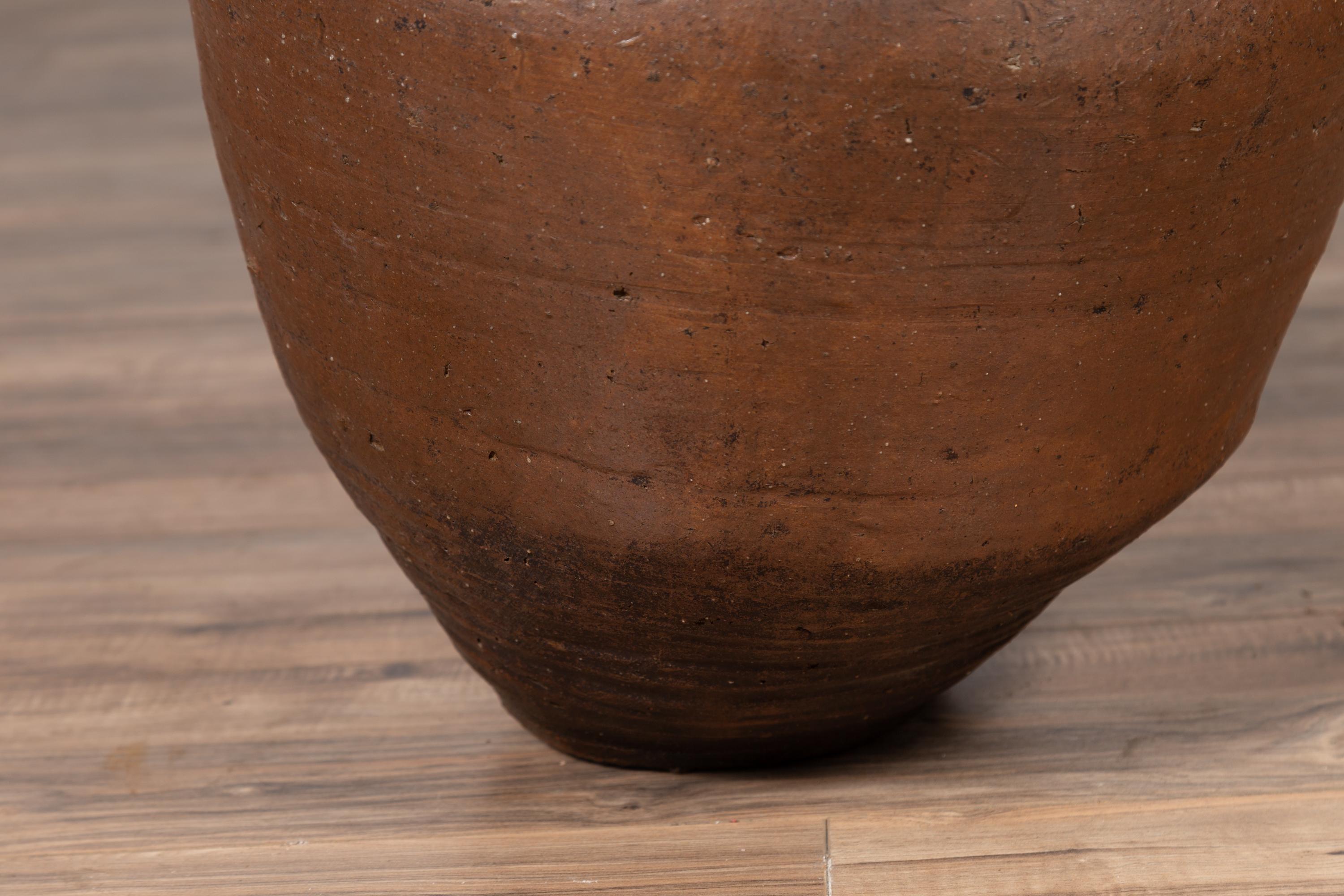 Pottery Antique Japanese Brown Oil Jar with Weathered Appearance and Irregular Shape For Sale
