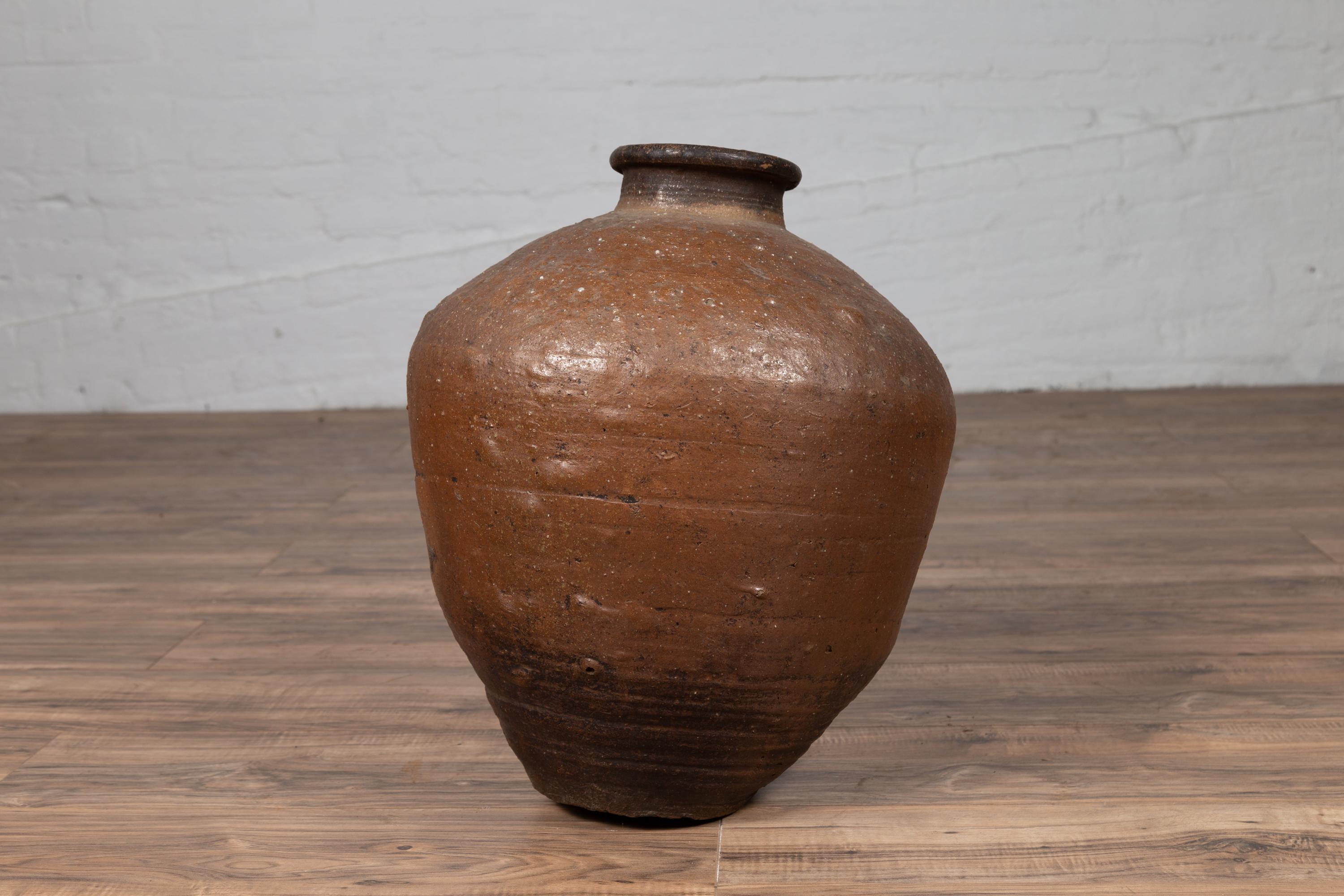 Antique Japanese Brown Oil Jar with Weathered Appearance and Irregular Shape For Sale 1