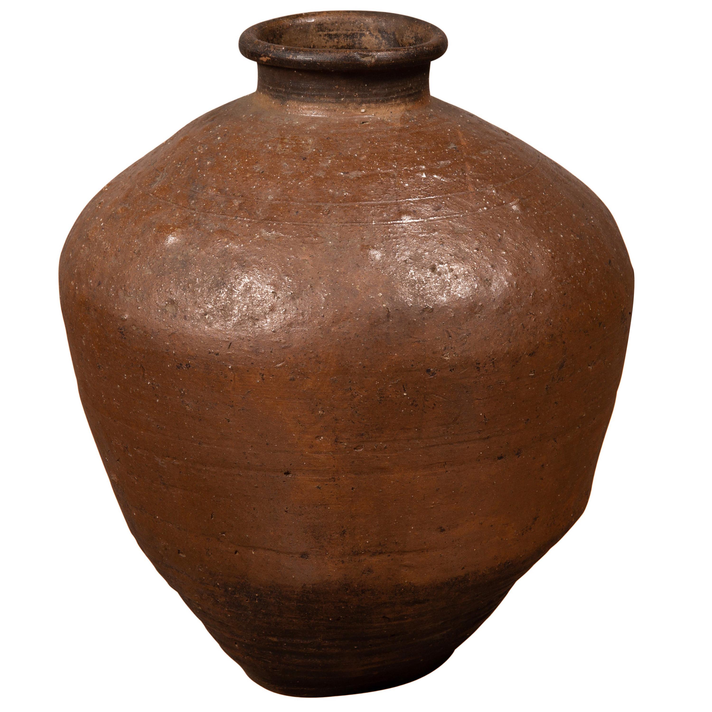 Antique Japanese Brown Oil Jar with Weathered Appearance and Irregular Shape For Sale