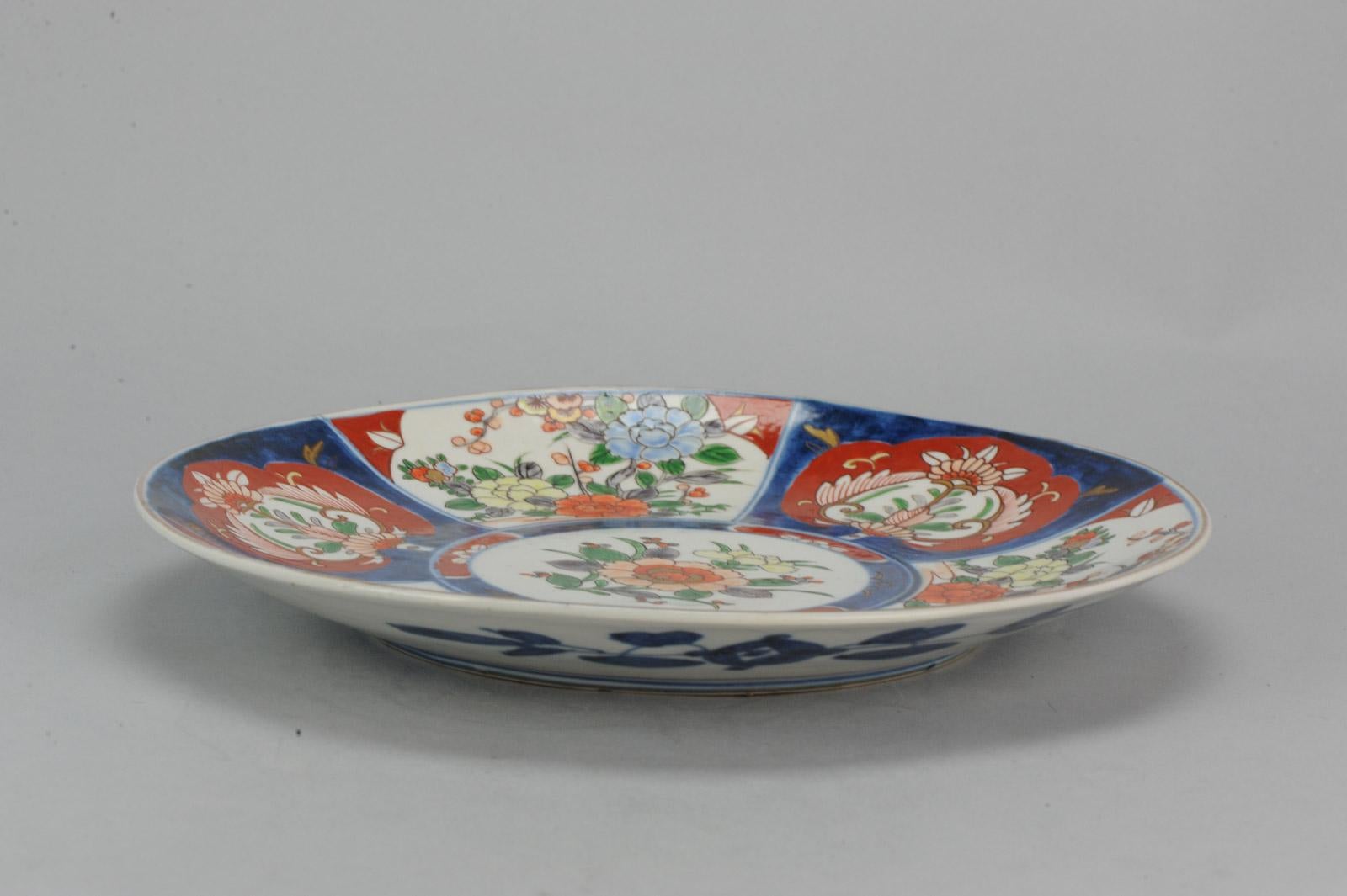 Huge and very nicely painted Japanese Charger with Imari decor. Marked at Base.

Additional information:
Material: Porcelain & Pottery
Type: Chargers (Large Plates), Plates
Region of Origin: Japan
Period: Meiji Periode (1867-1912)
Age: 19th