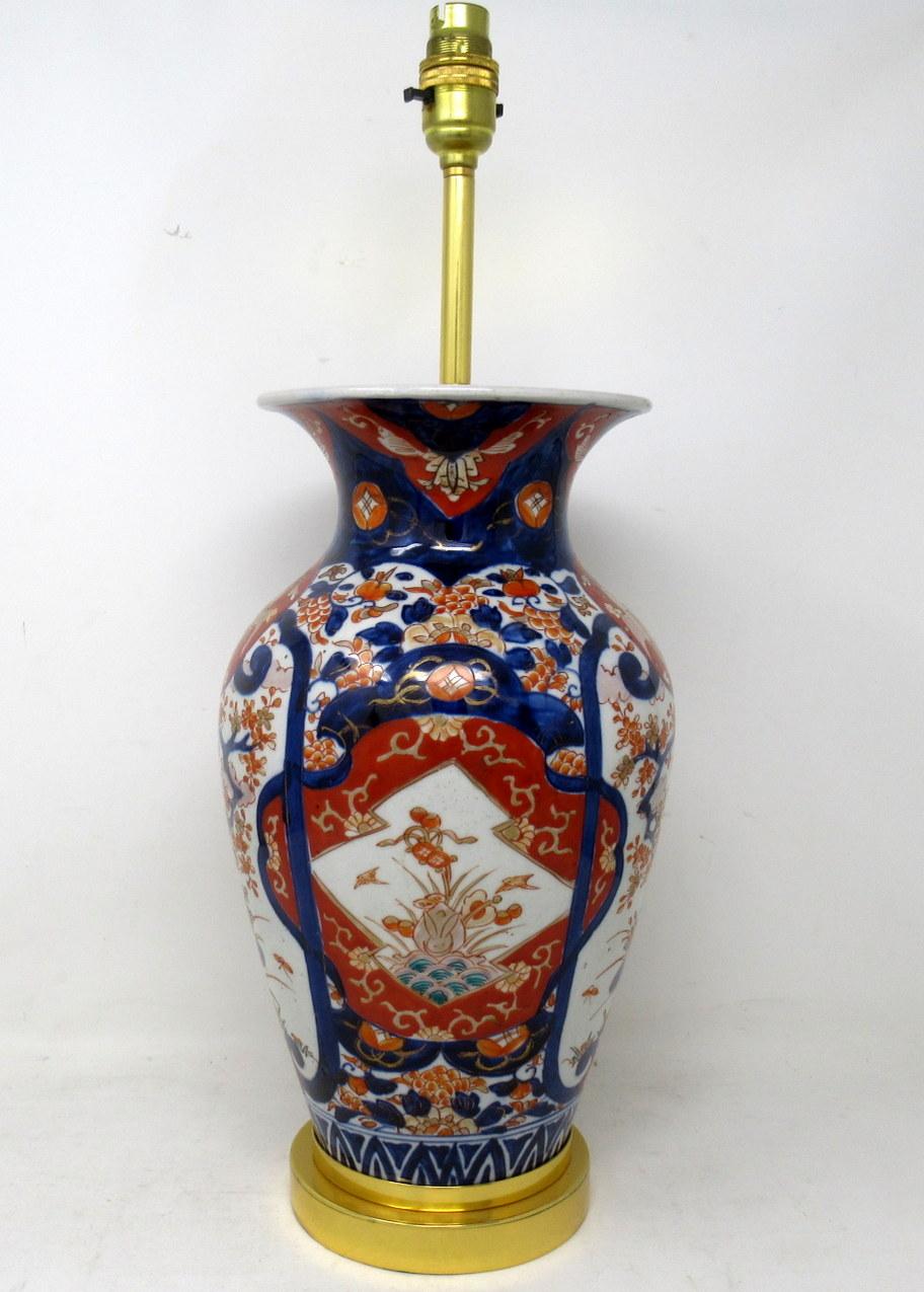 Stunning single Traditional Japanese Imari Bulbous form Porcelain vase of quite large proportions, now converted to an electric Table Lamp, complete with ormolu heavy gauge stepped circular base with attractive later ormolu mount. Second half of the