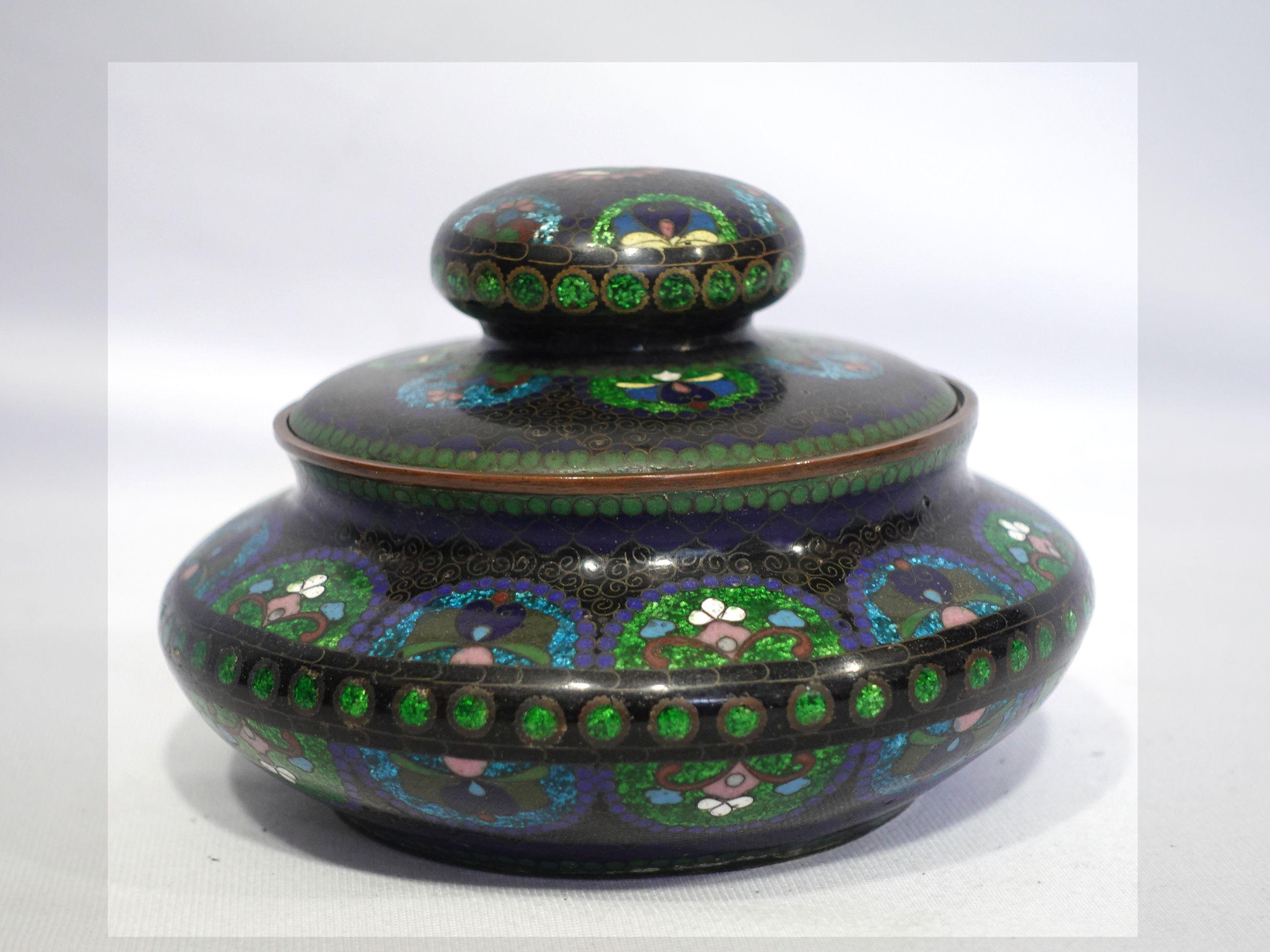 Quality work, amazing workmanship with absolutely fine details bronze cloisonné enameled lidded box depicting lots of intricated patterns all around the body with vivid colors of cyan, blue, light golden green, red, and brown.
4.25