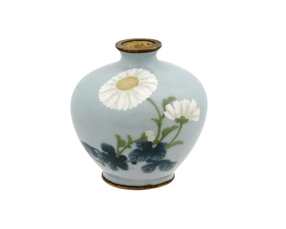 A high quality antique Japanese, late Meiji Era, copper and wireless enamel vase. A sphere shaped body is covered with a polychrome image of blossoming flowers made in the Cloisonne wireless technique. Circa: early 20th century. Unmarked. Antique