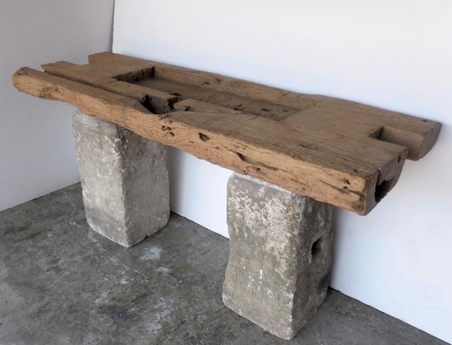 A very rustic, organic modern Japanese elm wood tray atop 19th century stone bases from Guatemala. A perfect marriage! Great patina on all pieces.
