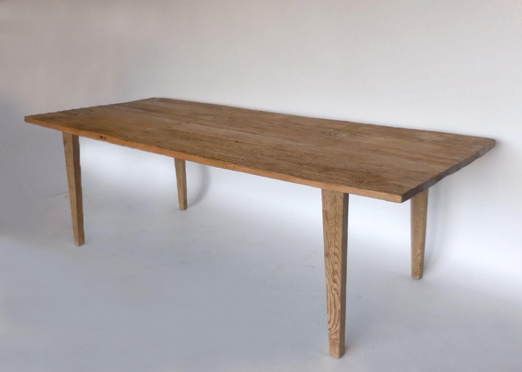 Rustic 200 year old Northern elm wood top with narrow profile tapered legs. Weathered natural patina similar to driftwood. Surface is flat and wine glasses are steady! Clean and modern, yet rustic.

   