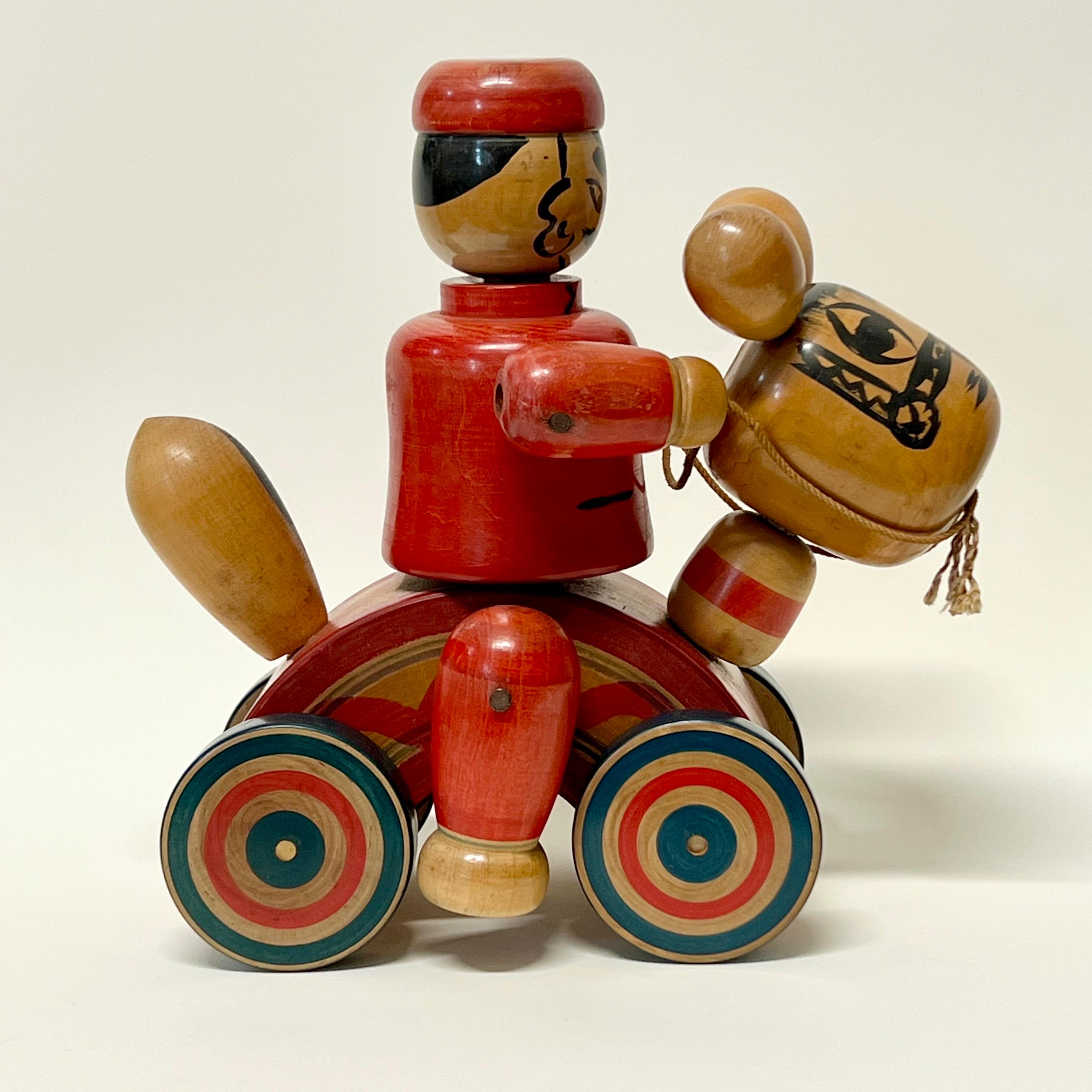 Fantastic whimsical antique Japanese large folk art Mingei horse and rider pull toy. Hand painted, arms and legs can be articulated. Purchased first hand in Kyoto. Incredible condition, stunning example of Japanese craft. Very uncommon piece in this