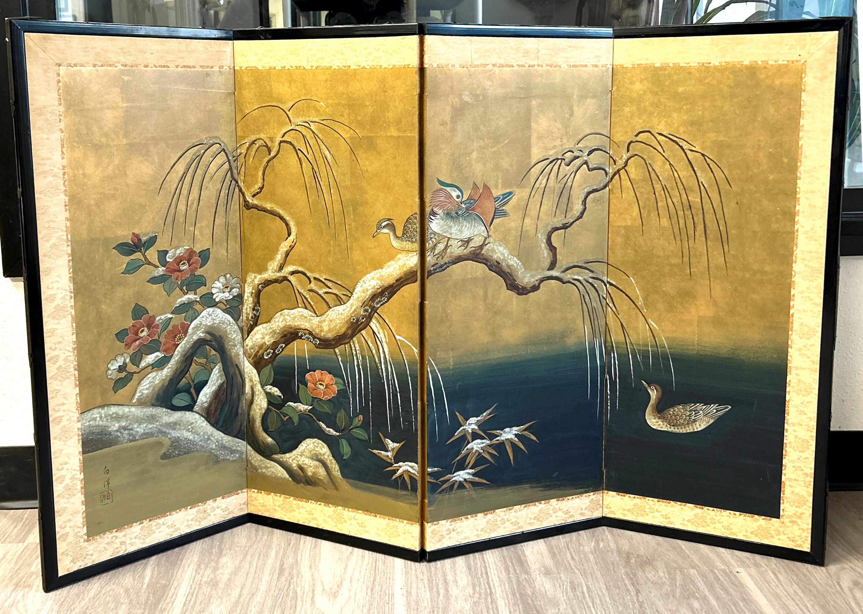 Antique Japanese Four Panel Byobu Screen: Mandarin Ducks by Snowy Pond in Early Spring.
Kano School painting of a weeping willow tree with branches over a stunning indigo blue pond. Some early spring flowers by pond's edge. Mineral pigments on gold