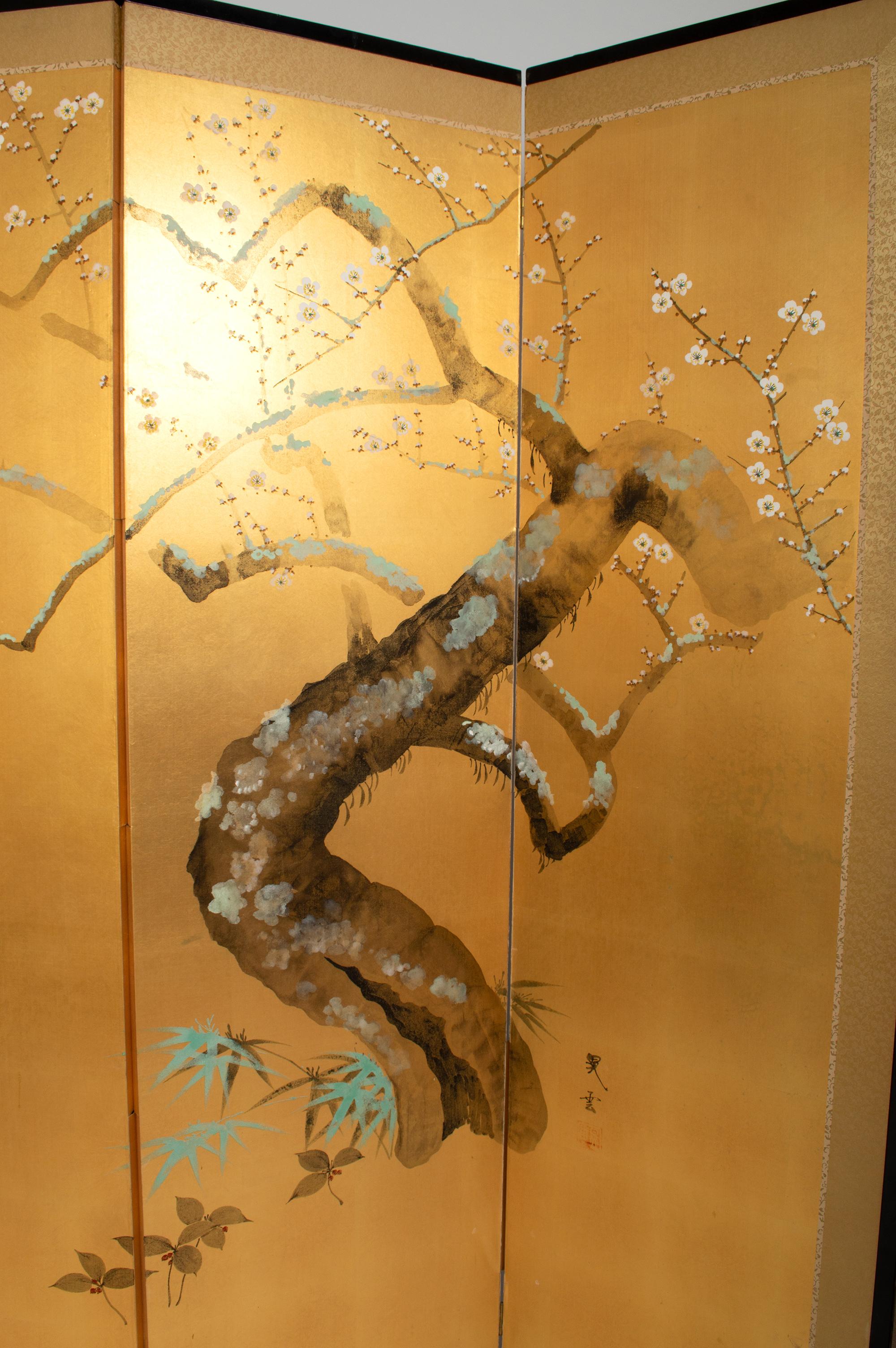 Antique Japanese four-panel screen ‘Byobu’. Nihonga School, Showa period, circa 1930.
The four-panel screen is in gold leaf with the depiction of a flowering prunus tree with spring blossom in vivid mineral pigments. Gold leaf plated mulberry paper