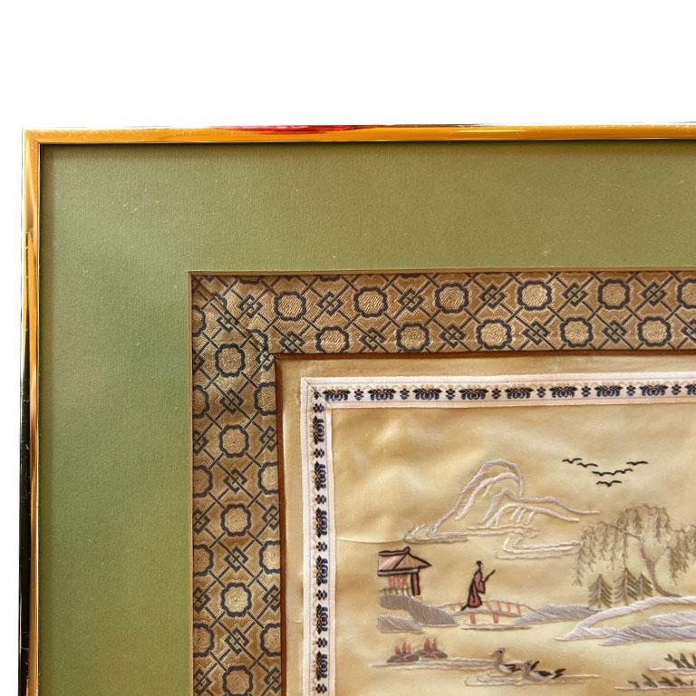 A beautiful piece with an incredible history. This exquisite hand-embroidered tapestry was created in Japan and purchased by an American man who taught English. The scene depicts a traditional Chinese garden with a figure walking over a bridge