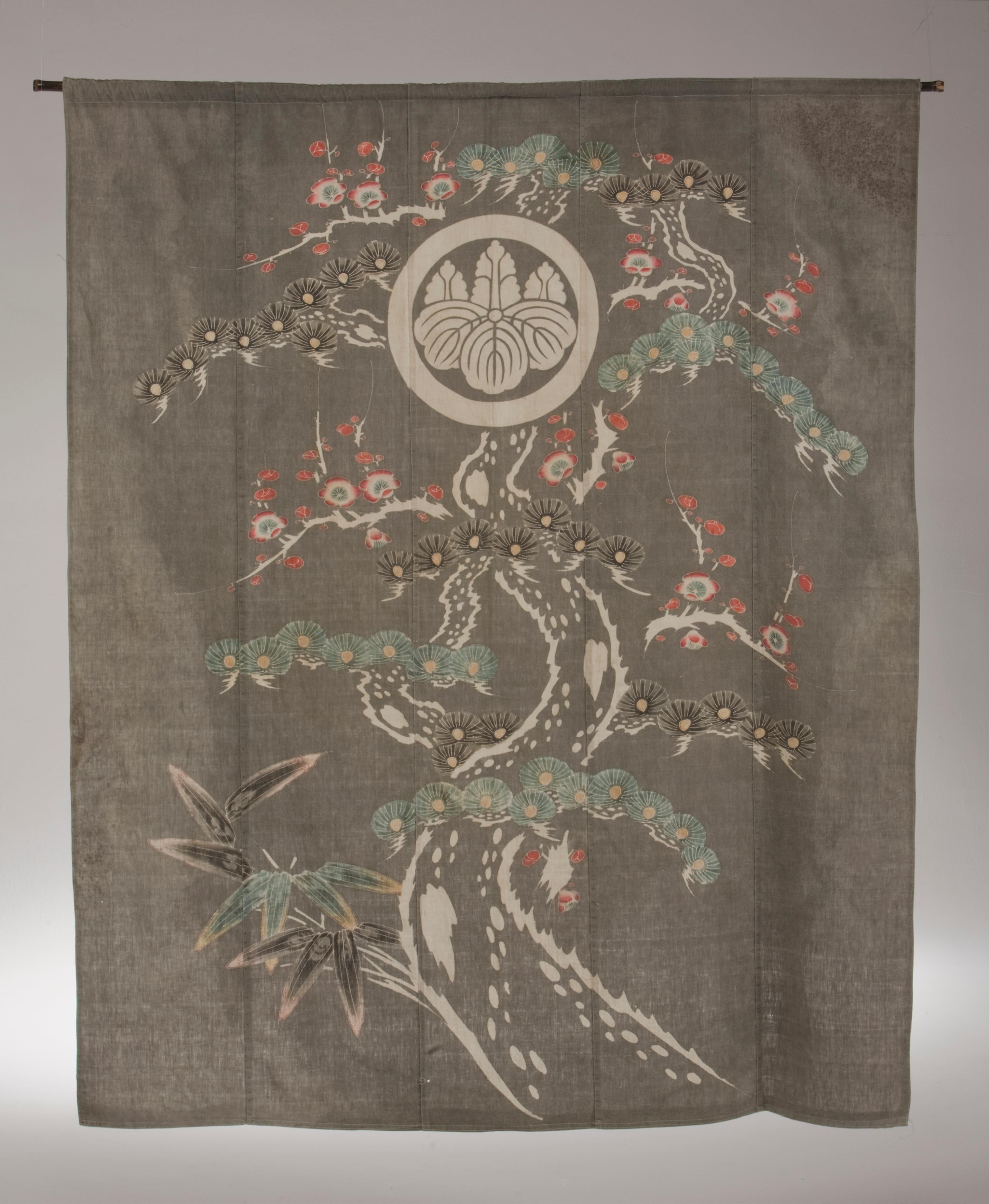 Antique Japanese Futon Cover featuring Pine with Plum Blossoms and Bamboo

Unusual Background-Color of Gray with Plum Blossoms, Pine, and Bamboo
Futon Cover Center is the Family Crest (Mon).
Cotton Paste Resist, Tsutsugaki
Tsutsugaki is a