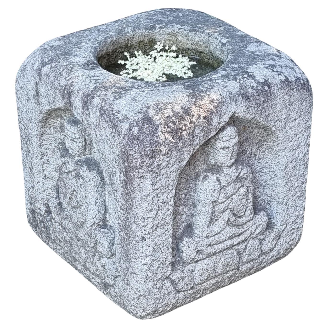Antique Japanese granite chôzu’bachi 手水鉢 (water basin) with carved Buddha design