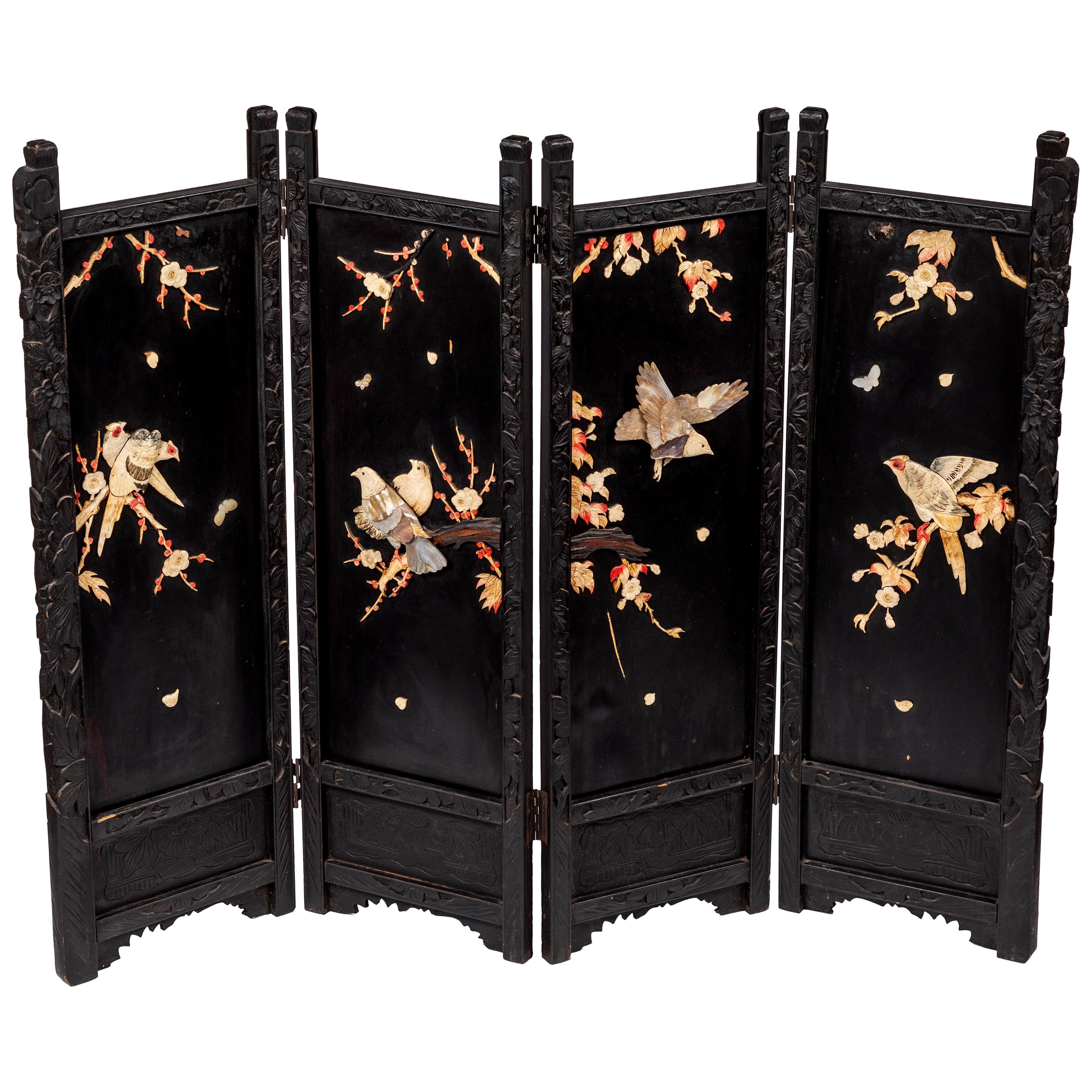 Black lacquer panels decorated with carved Mother of Pearl + Bone Birds and cherry blossom branches.