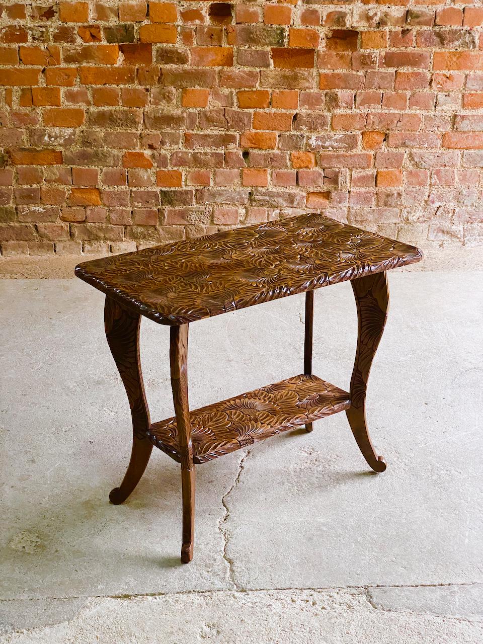 Antique Japanese hand carved cherrywood side table circa 1920

Stunning antique Japanese hand carved cherrywood side table Japan circa 1920, the rectangular top with deeply carved flowers covering the entire surface of the table, graphically bold