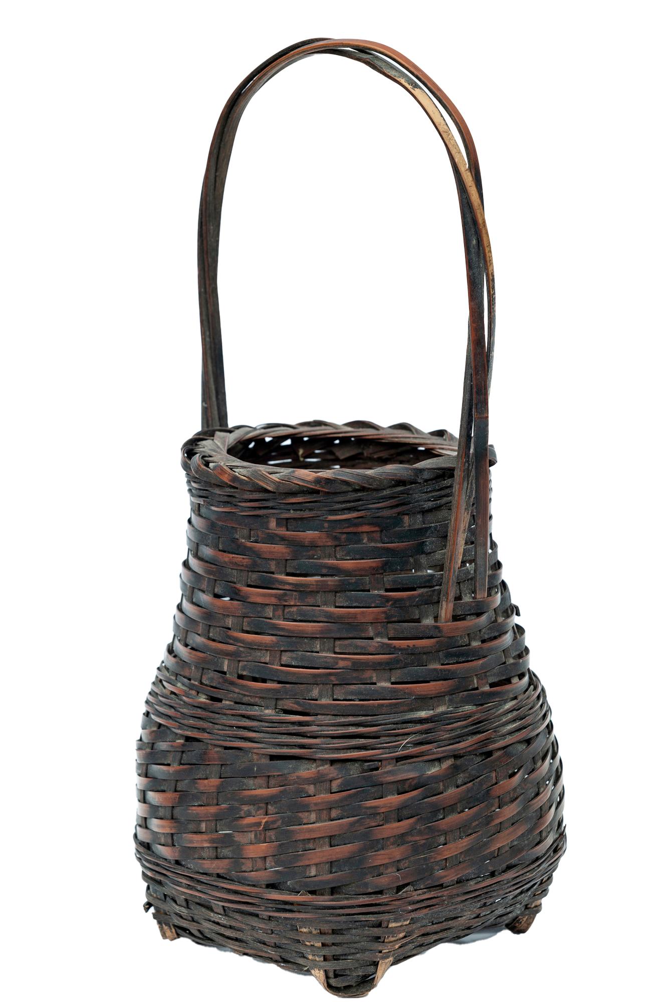 Finely woven Ikebana bamboo basket patinaed surface.