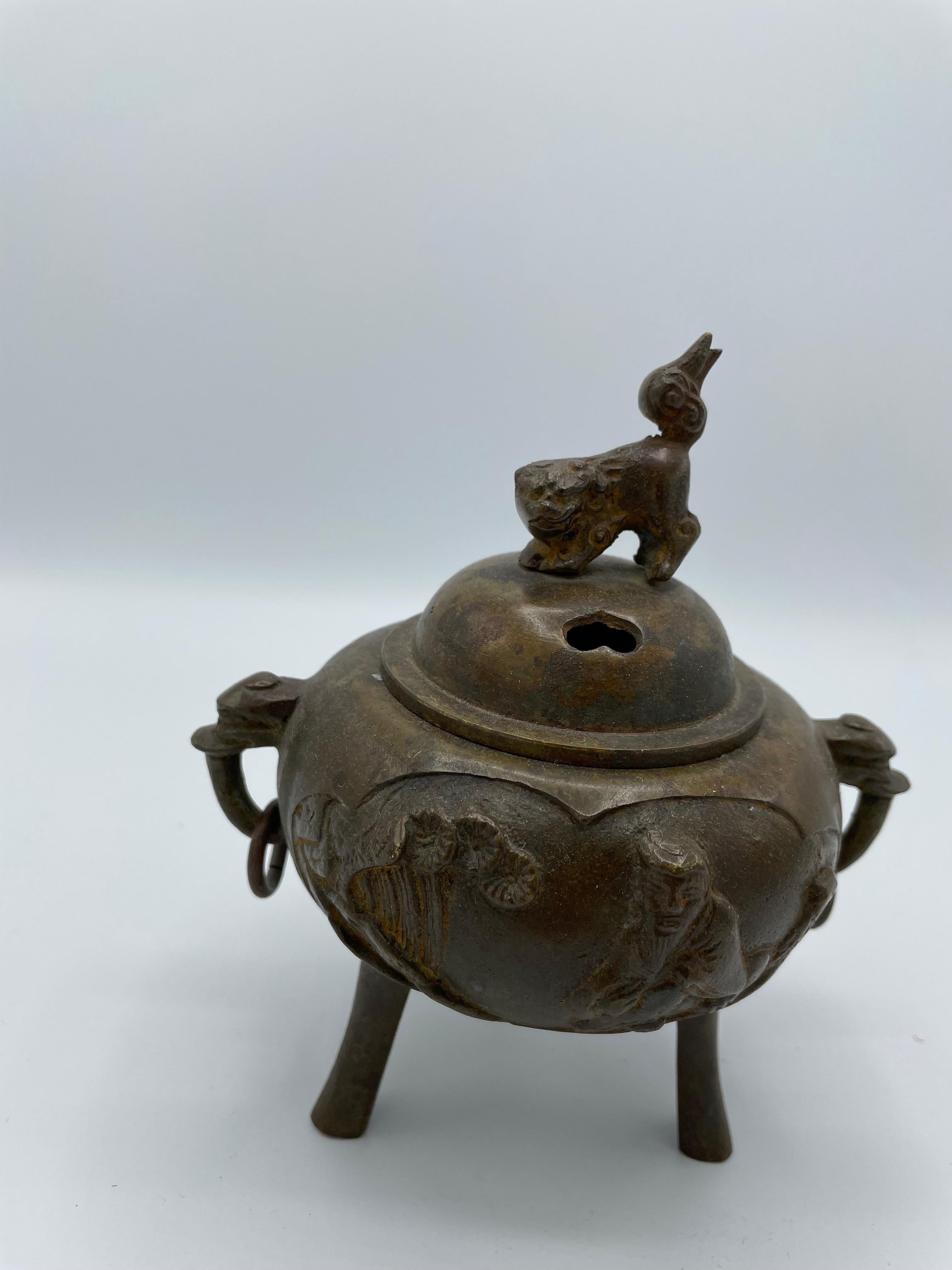 This incense burner was made in 1920s (Taisho era) in Japan.
On the top, there is a Komainu (Lions that guard the entrance or the honden of sanctuaries). 
It can use as incense burner but also as a decoration.

Dimensions: 11 x 13 x H14 cm