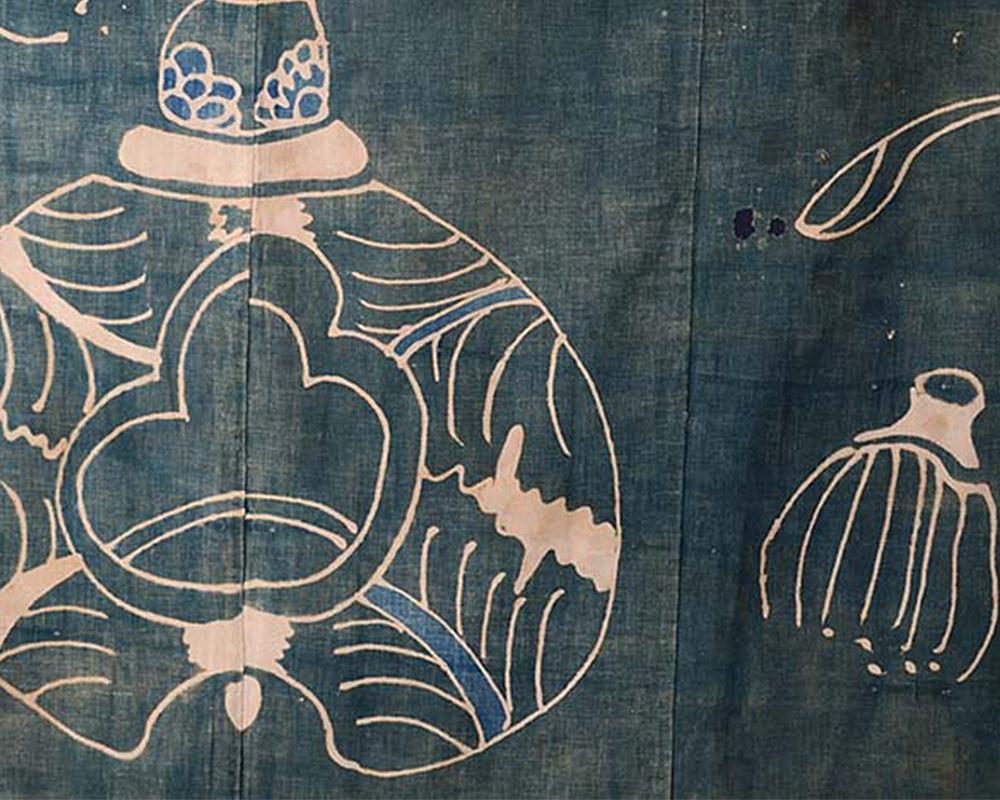 Unusual antique Japanese indigo 'Tsutsugaki' (free hand resist dyed) futon cover with a tea ceremony motif. Dating from the 19th century it is faded, worn and mended but this just adds to its unique and naive charm. The futon cover is made from hand