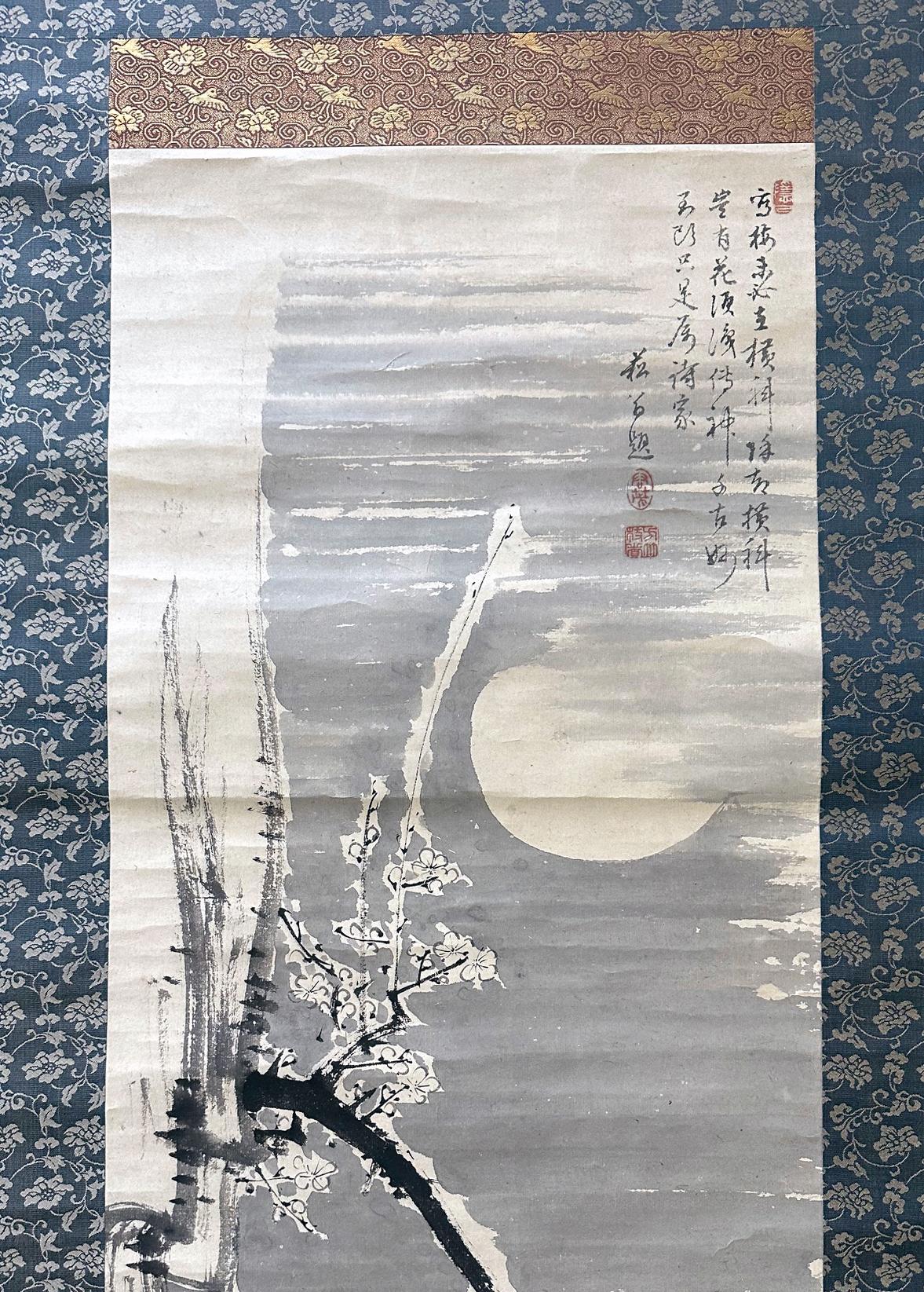 An ink painting on paper (Sumi-e) mounted with brocade borders as a hanging scroll. Entitled 