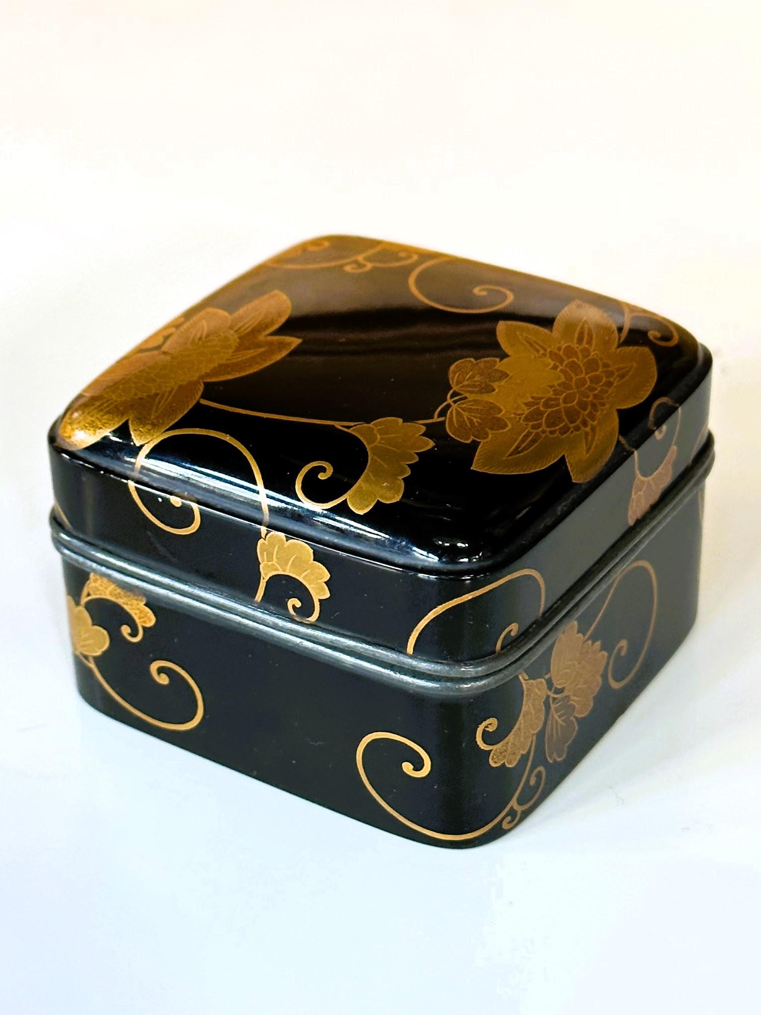 An antique lacquered small box that was likely used to contain incense powder (it is called Kobako in Japanese), circa early to mid-19th century of the Edo period. The square form box with a fitted lid features a slight dome shape with rounded