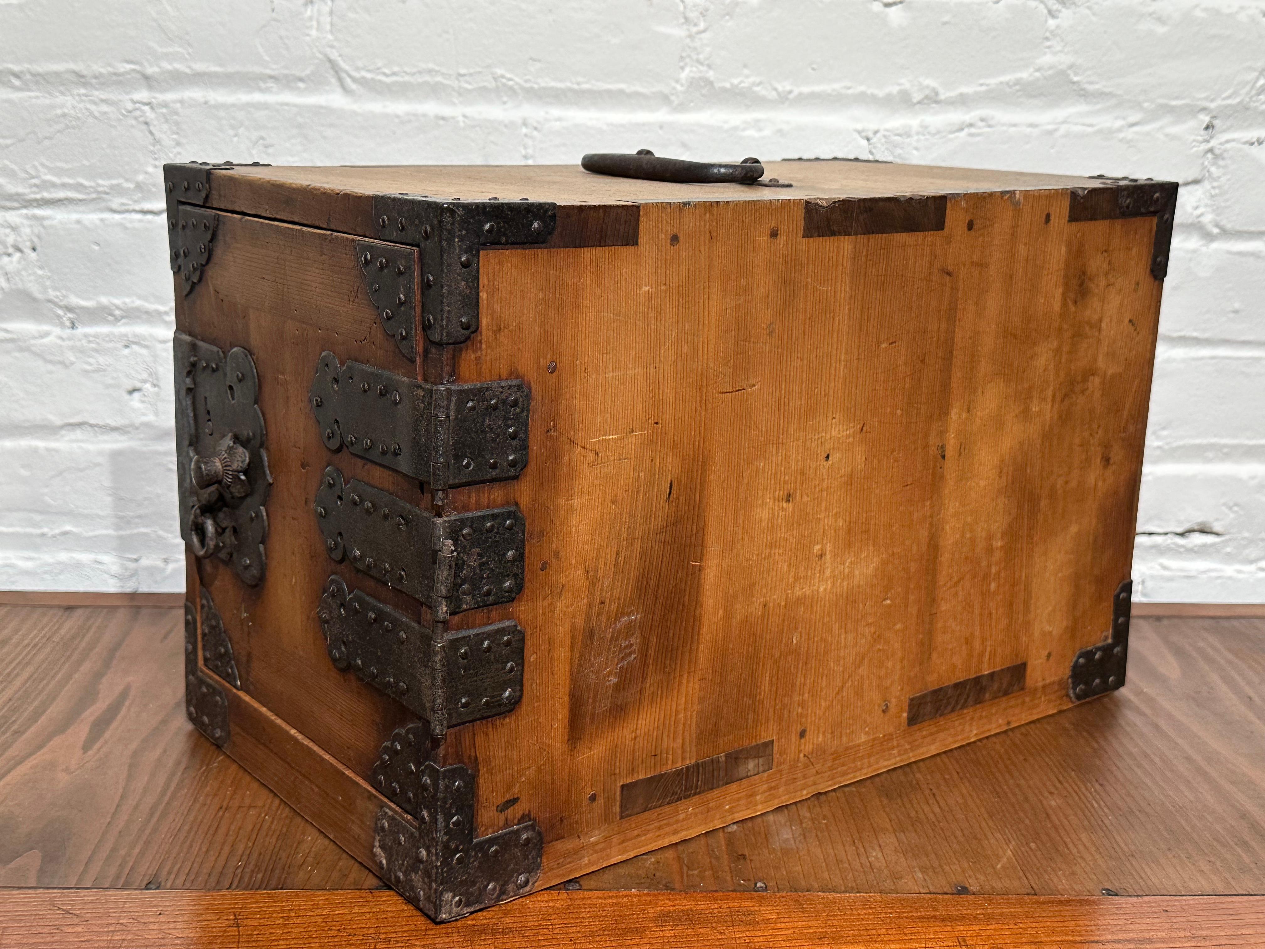 Available from Shogun's Gallery in Portland, Oregon for over 40 years specializing in Asian Arts & Antiques.

Known as a kakesuzuri (portable document chest) or a funadansu (ship's chest) from the late Edo era (c 1860). This tansu chest has three 