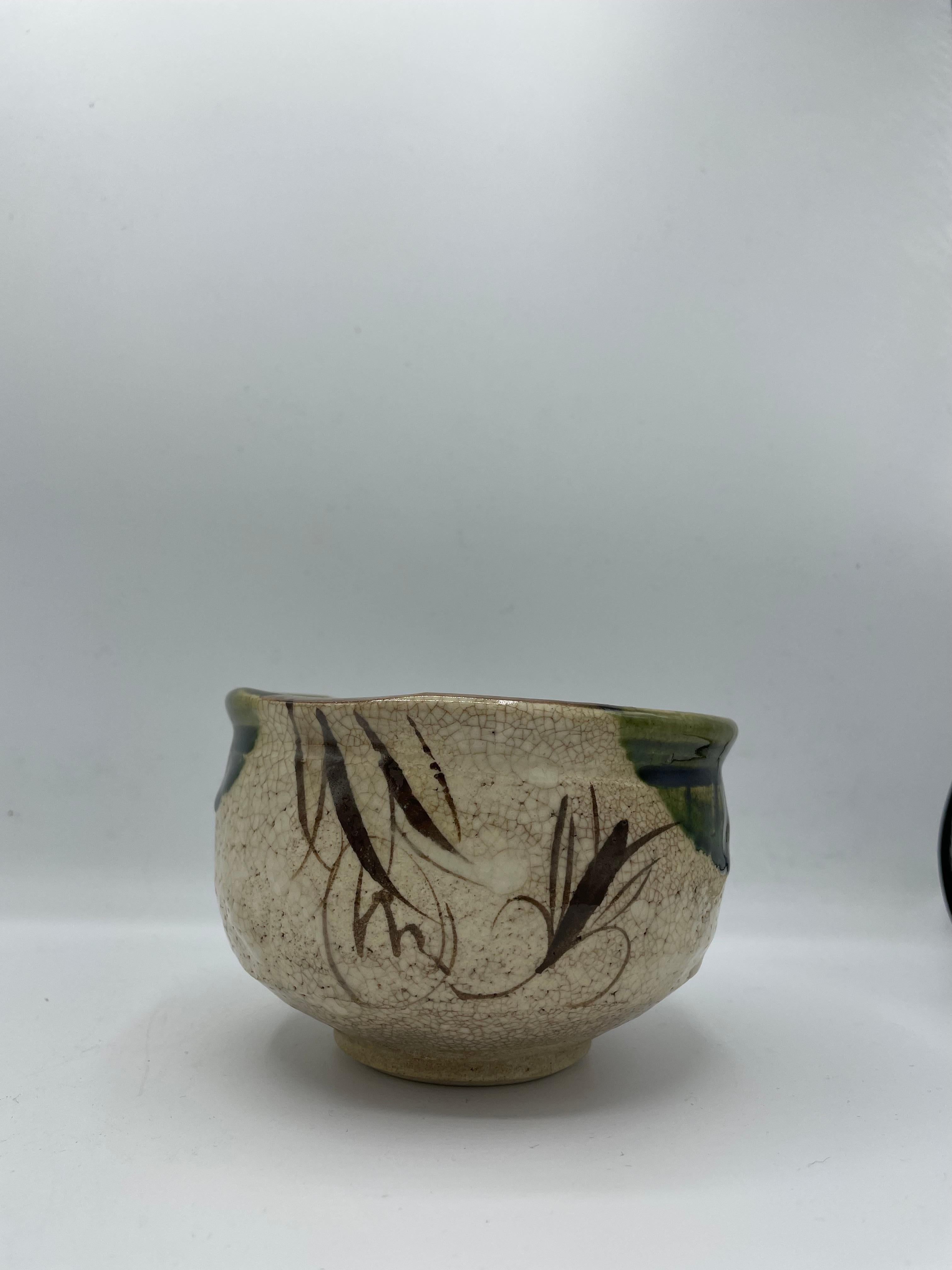 This is a matcha bowl serving during tea ceremony.
This item was made around 1960s in Showa era in Japan with style Oribe ware.
It was made in pottery place called 'kajitsu (kama)', we can find the stamp on the bottom of this bowl.

Oribe ware