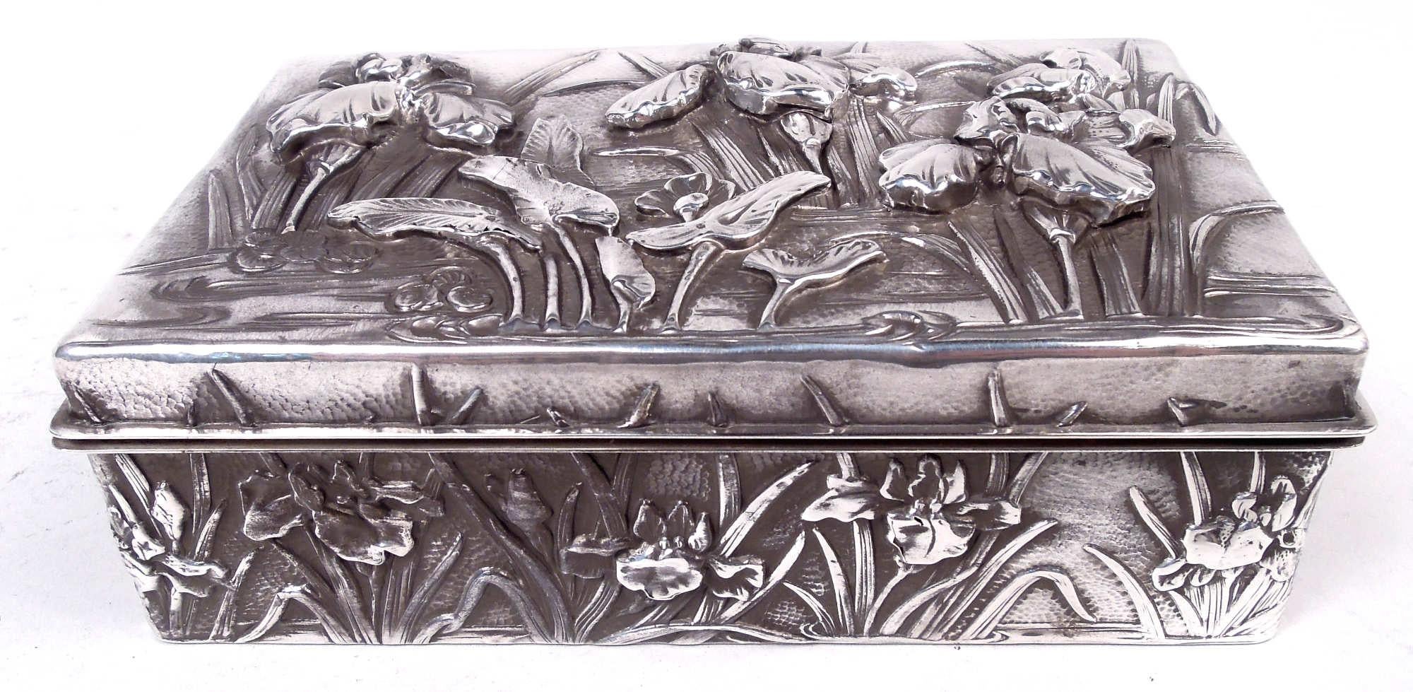 English Victorian Classical sterling silver cann, 1864. Baluster bowl with leaf-capped double-scroll handle and raised and beaded foot. Four scroll frames with leaf and bead surrounds; two inset with flowers and two vacant. Gilt interior. Fully