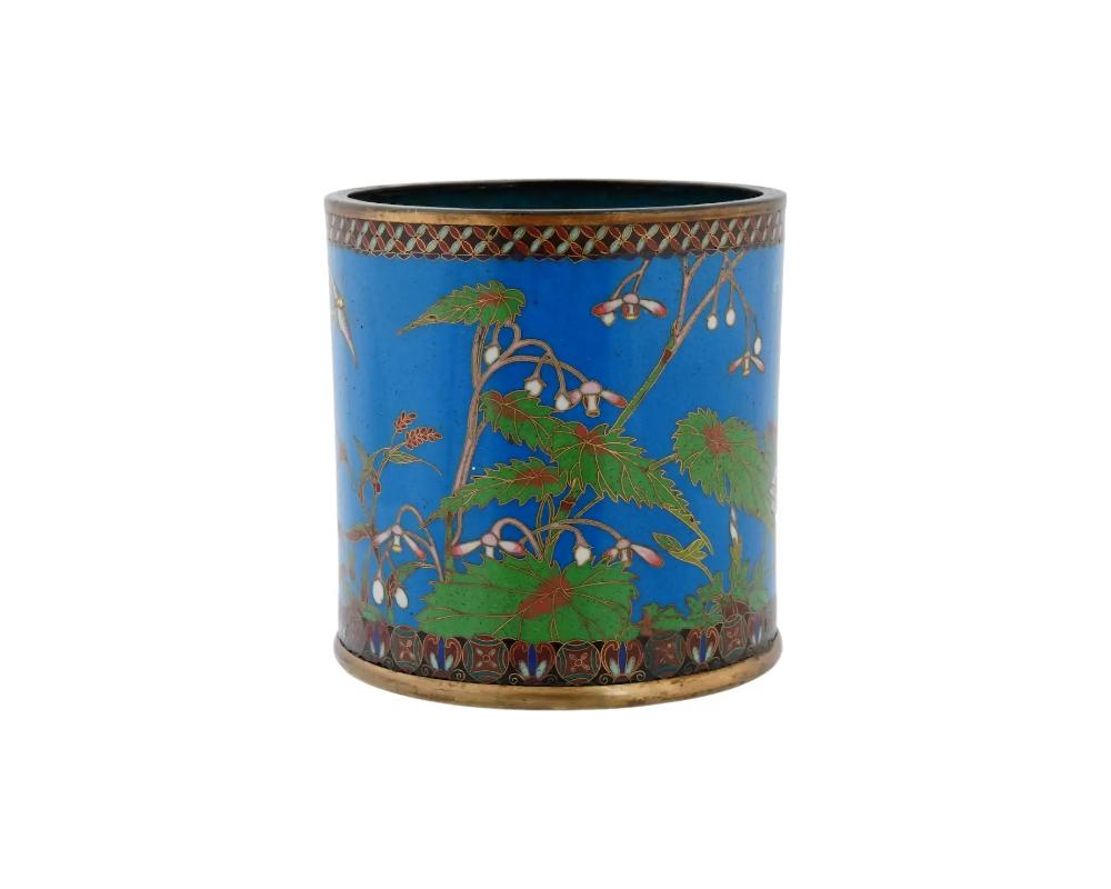 An antique Japanese copper brush pot with cloisonne enamel design. Late Meiji era, before 1912. Cylinder shape. The item is decorated with depictions of flowers and butterflies against the turquoise background. Oriental Decor For Interior Design,