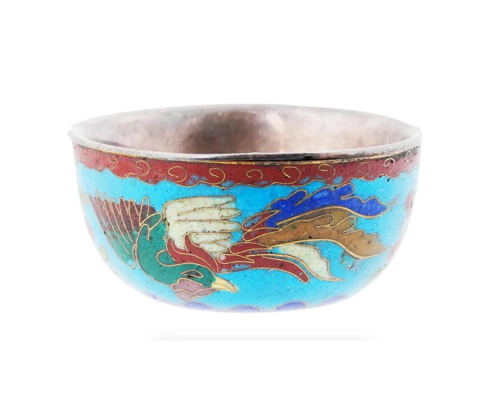 An antique Japanese copper sake cup with cloisonne enamel decor. Late Meiji period, before 1912. The design represents a peacock and flowers against the turquoise background. Oriental Tableware Drinkware For Collectors.

Dimensions: D 1 7/8 in.