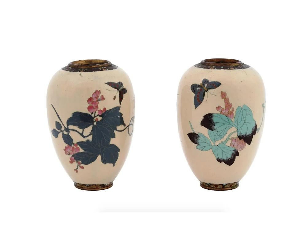 A Pair of Barrel Shaped Japanese Meiji Cloisonne Enamel Butterfly Vases In Good Condition For Sale In New York, NY