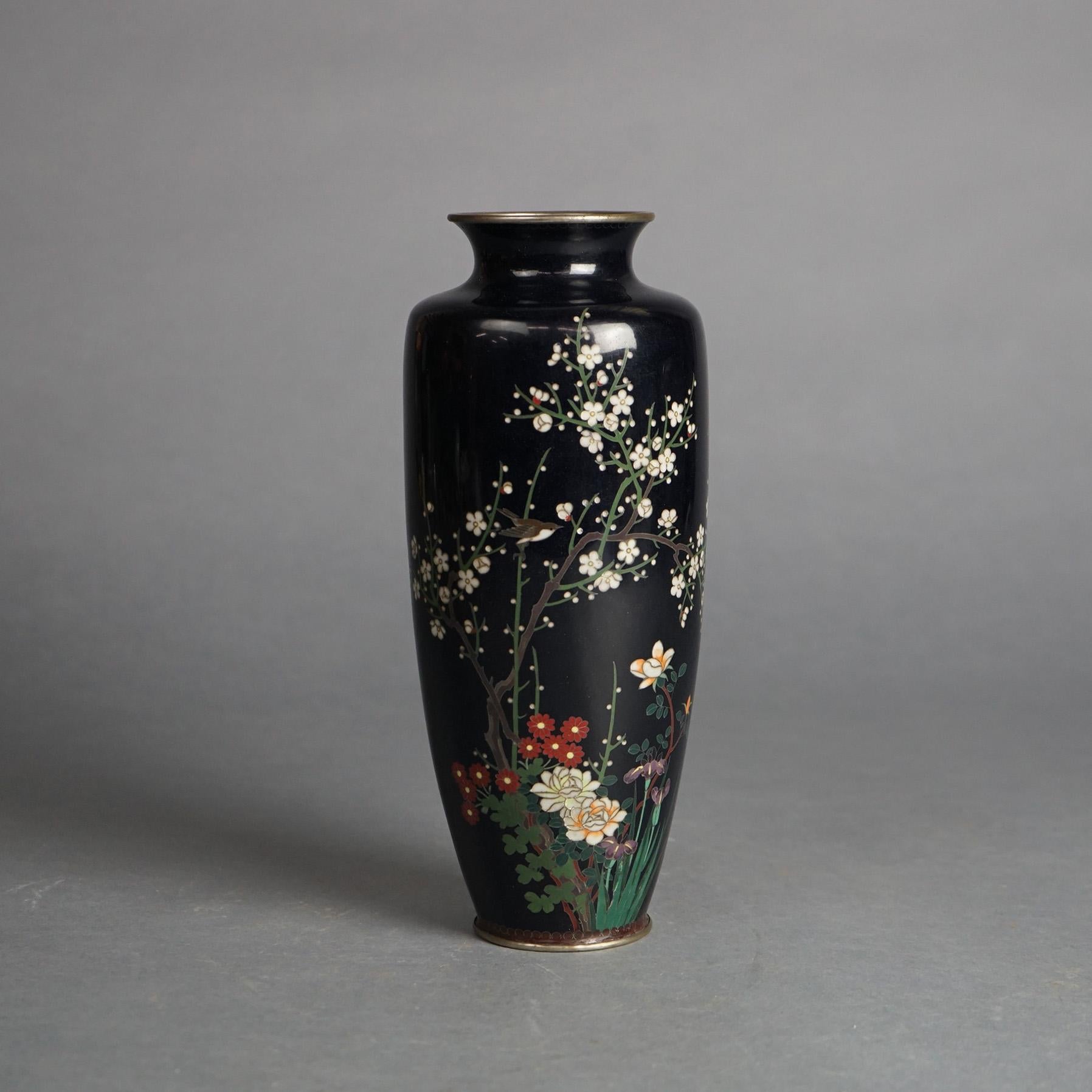 Antique Japanese Meiji Cloisonne Enameled Garden Scene Vase with Flowers & Birds, C1920

Measures- 9.75''H x 4''W x 4''D