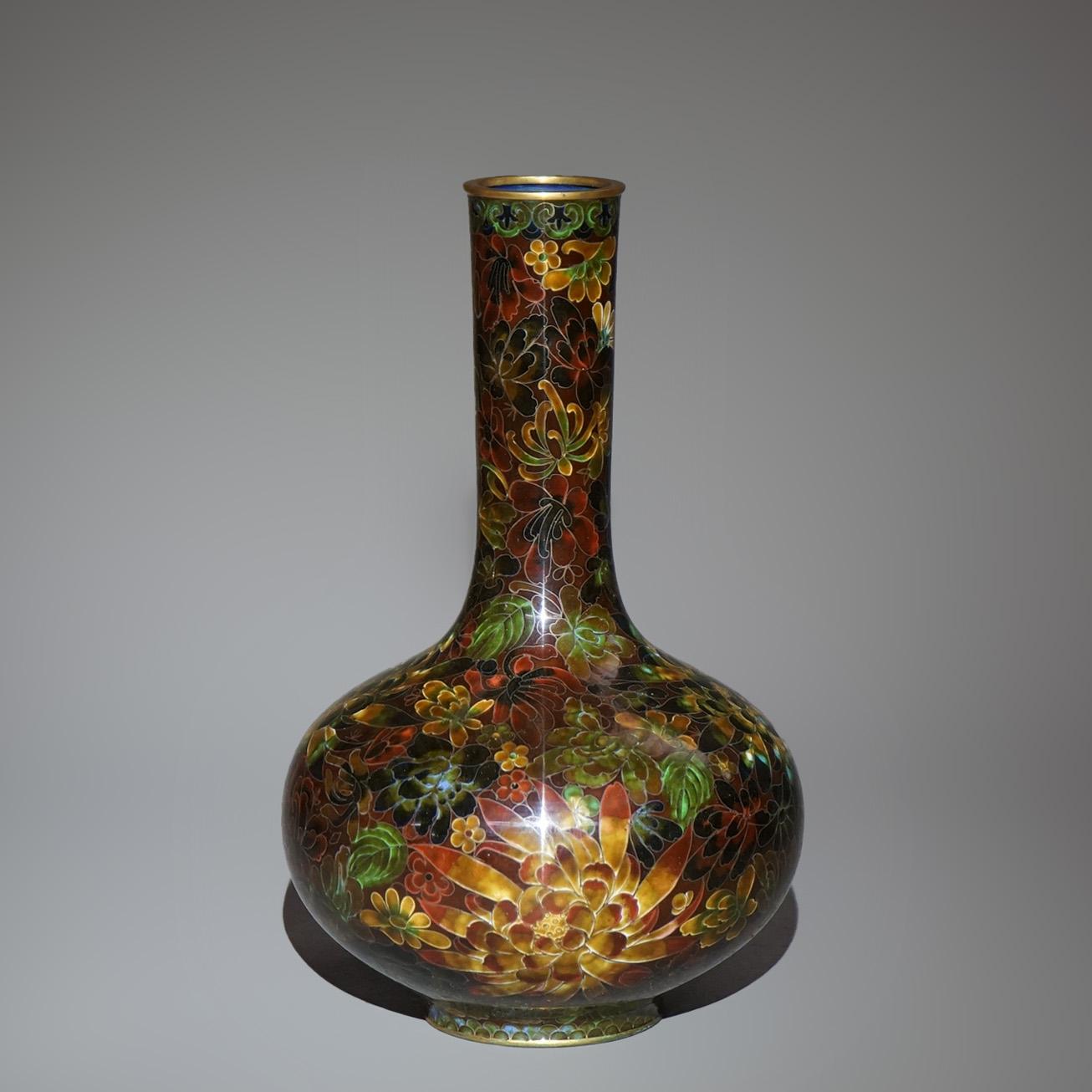 An antique Japanese Meiji vase offers metal construction with allover Cloisonne enameled floral design, 19thC

Measures - 122.25