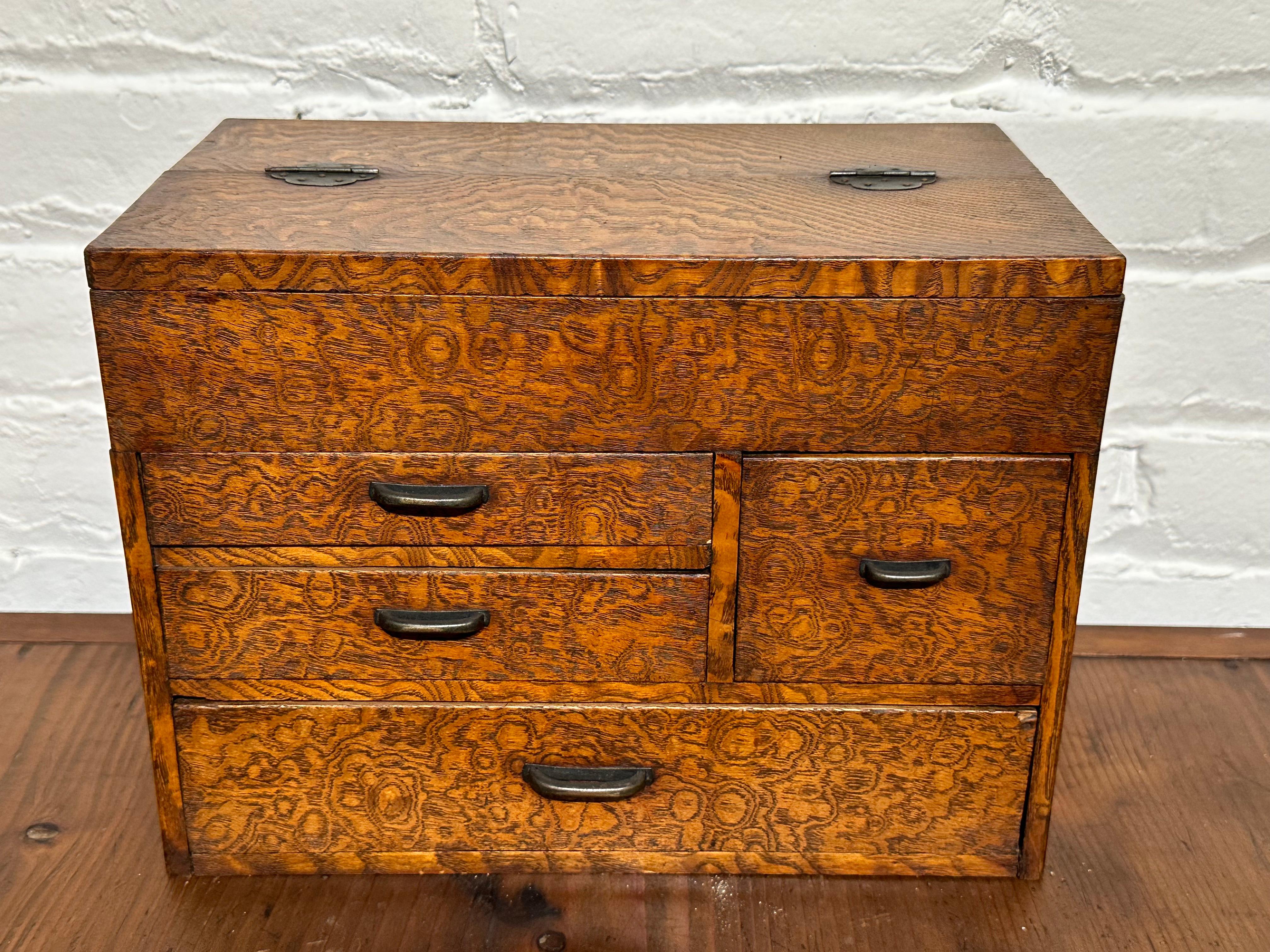 Available from Shogun's Gallery in Portland, Oregon for over 40 years specializing in Asian Arts & Antiques.

This is a Taisho era (c1920's) Haribako (sewing box) with an arrangement of four exterior drawers. The lidded top section is divided into