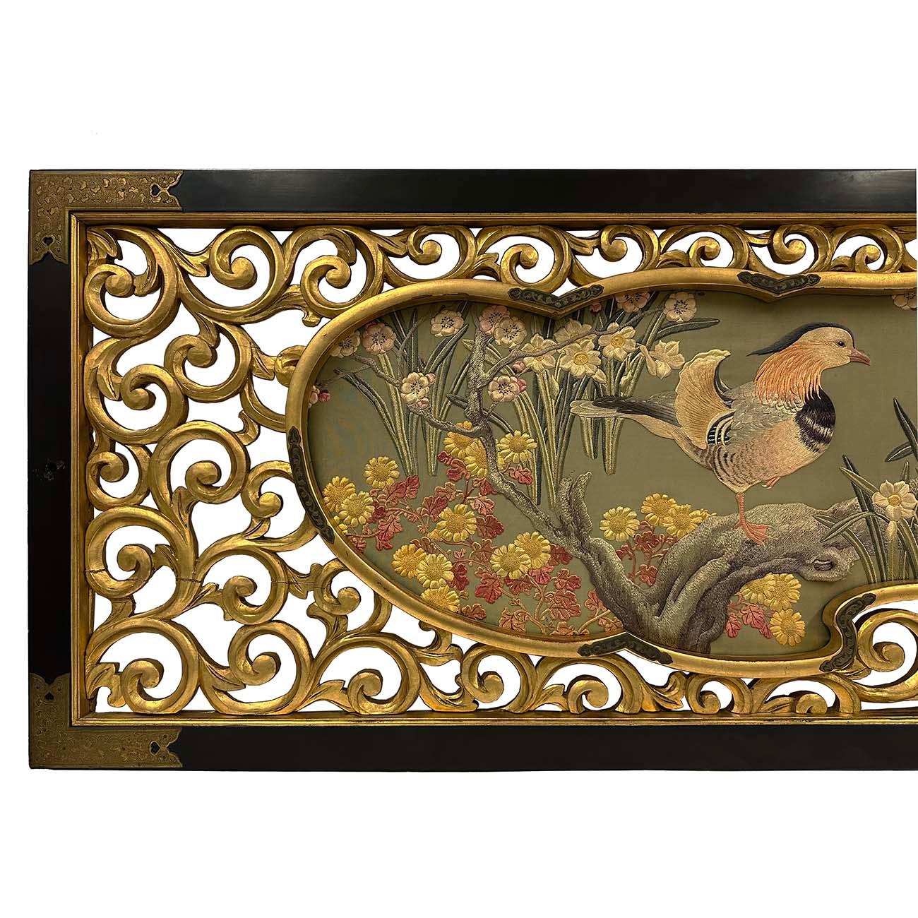 Hand embroidered in Japan, this large framed silk embroidered wall art was made in Meiji era, approximated 1900s. Very detailed hand embroidered mandarin duck and tree and floral in a carved and gilt wooden frame.  Mandarin ducks symbolize love and