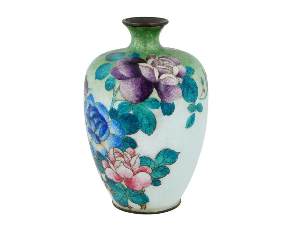 A large antique Japanese copper vase with polychrome ginbari cloisonne enamel decor. Late Meiji period, before 1912. Baluster shape with pronounced neck. White and green body with peony flower motif. Ginbari is a Japanese cloisonne technique when