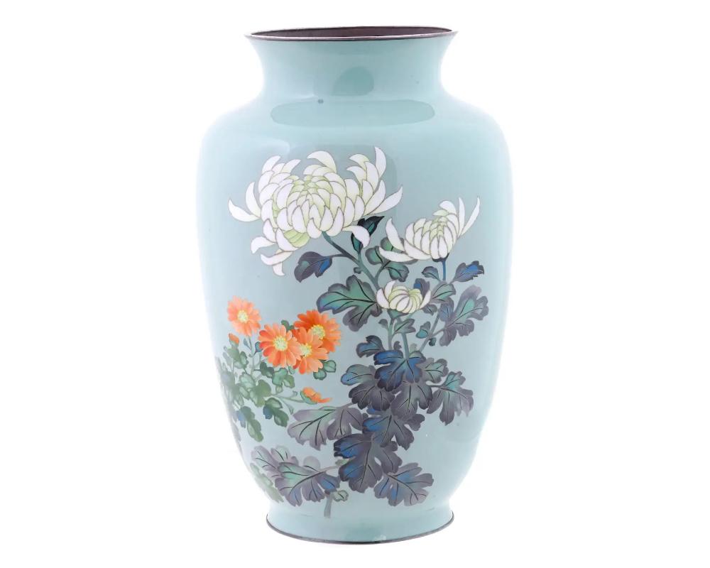 An ancient Japanese vase with magnificent flower decoration made in a polychrome cloisonne enamel on a pale turquoise ground. Classic form for Japanese works of the Meiji era. The base is marked with the mark Gonda Hirosuke, 1865 to 1937. Cloisonne