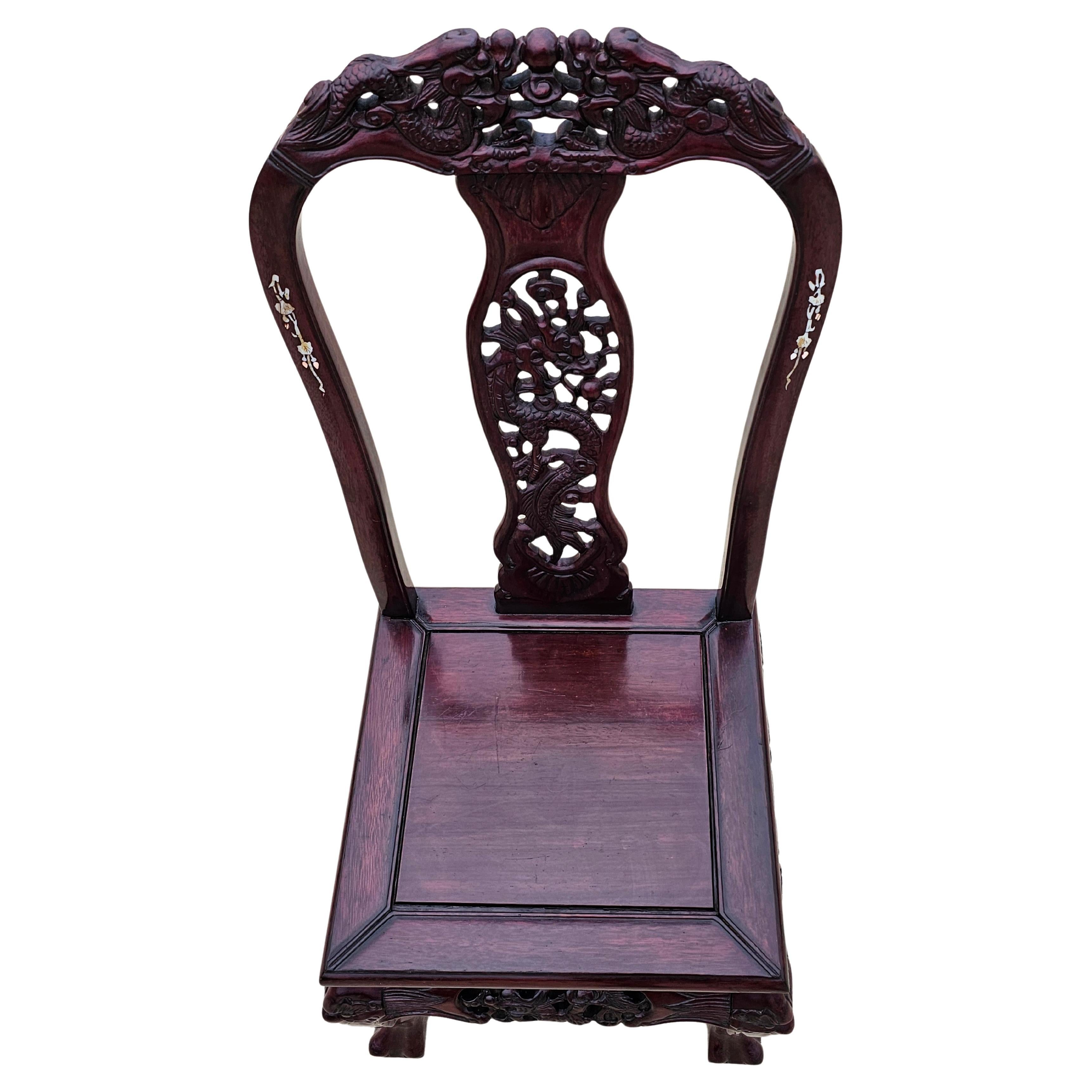 A stunning authentic antique Meiji Era (1867-1912) Japanese pearl and shell inlaid profusely hand carved hardwood chair with beautifully aged patina, warm rich coloring, dark grain detail, and interesting provenance!

Japan, turn of the late 19th /