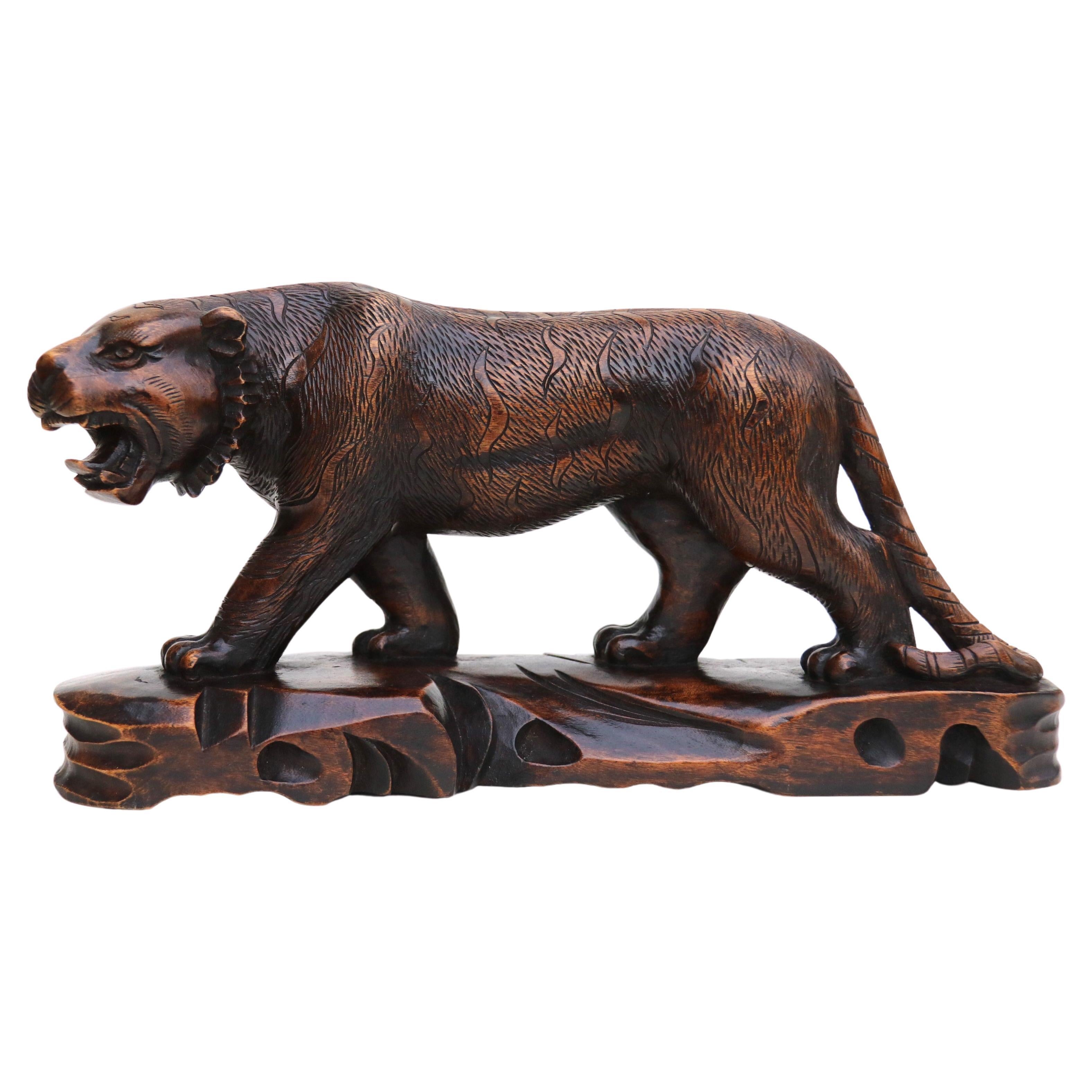 Antique Japanese Meiji period carved hardwood okimono of a prowling tiger C 1900
