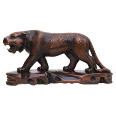 Antique Japanese Meiji period carved hardwood okimono of a prowling tiger C 1900