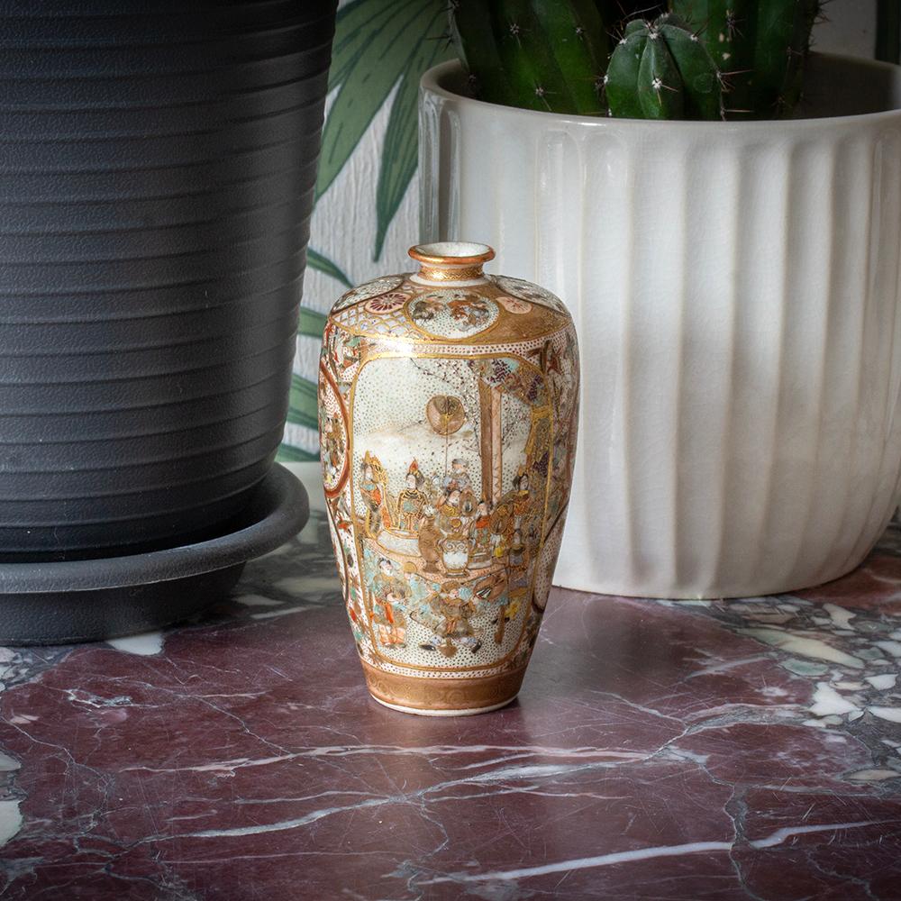 Painted with Lucky Gods

From our Japanese collection we are delighted to offer this Japanese Satsuma Vase by Ryozan. The Satsuma Vase composed of earthenware in ovoid form with a tightly pinched neck is beautifully decorated throughout with two