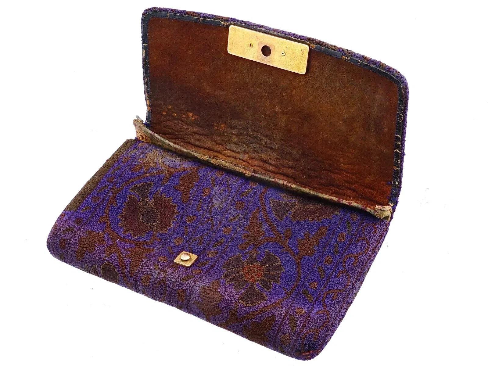 An antique Japanese Meiji Period tobacco pouch, featuring a leather interior and covered in French-knotted silk with floral patterns. The pouch is adorned with relief fish images on the lock. With the hand written certificate. Circa the early 20th