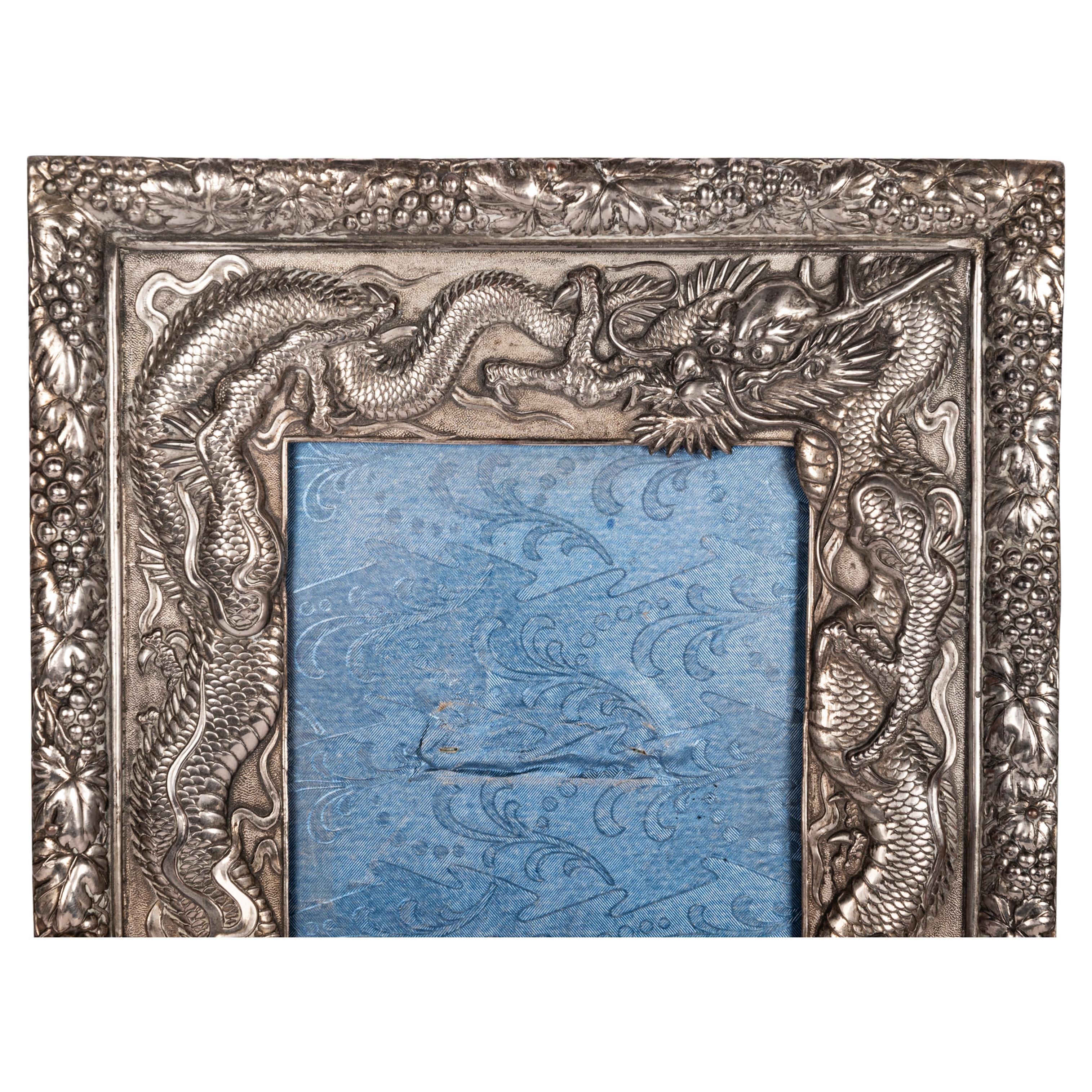 Antique Japanese Meiji period solid silver dragon photo/picture frame, circa 1900
This early-20th Century Japanese Meiji period solid silver water dragon photo frame is of exceptional quality, chased, embossed, repousse work & applied with a pair of
