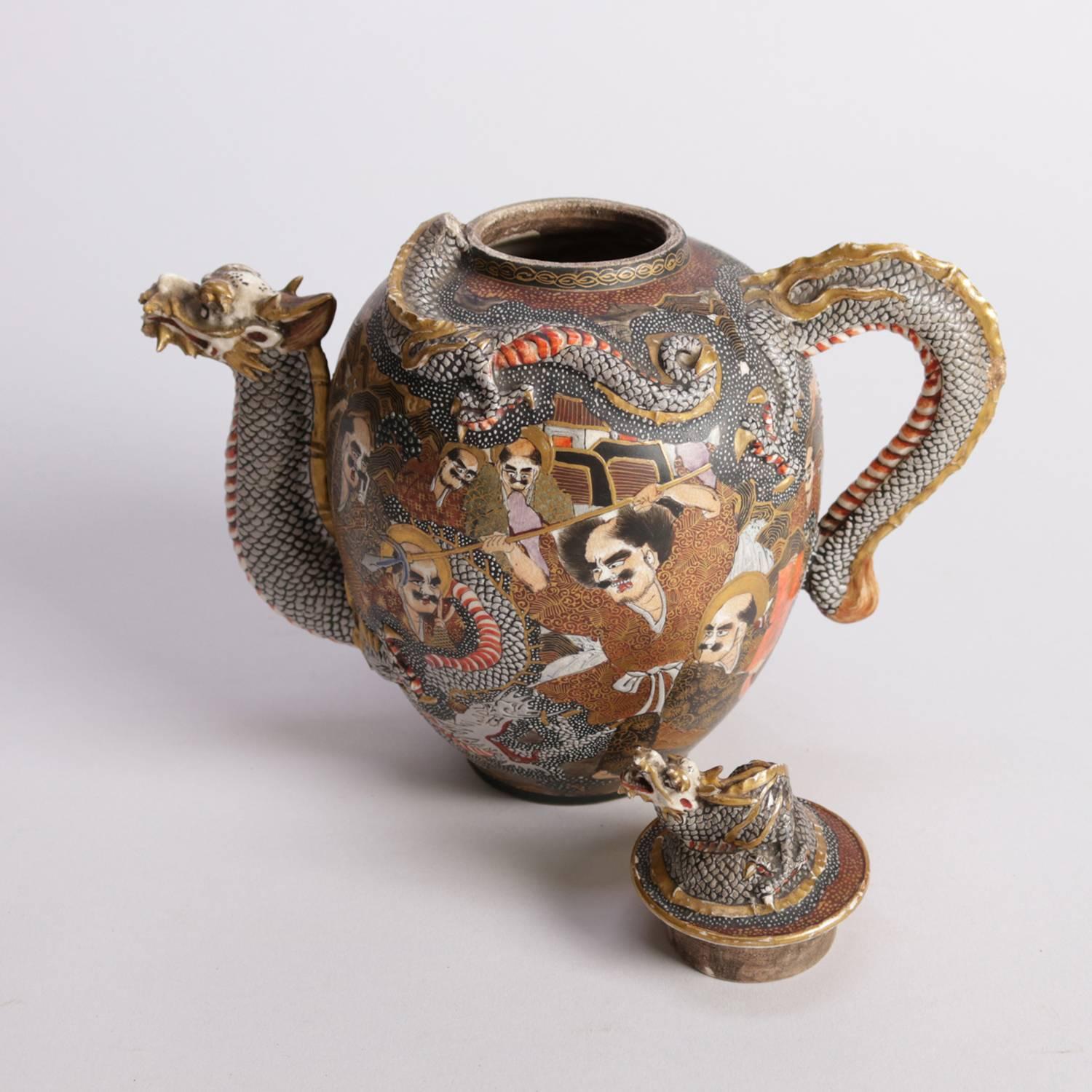 Antique Japanese Meiji figural porcelain lidded tea pot features all-over 1000 faces design with gilt highlights, Kyoto Dragon spout, handle and finial; base chop mark signed; 19th century.

Measures: 7.5