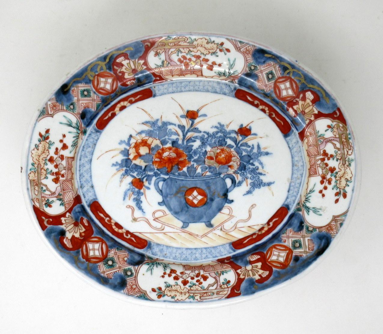 Stunning large Japanese or Chinese Imari oval form deep dish or centerpiece of outstanding quality, made during the last quarter of the 19th century.

Hand decorated with all-over typical decorative Imari palette in colors of iron red dark blues