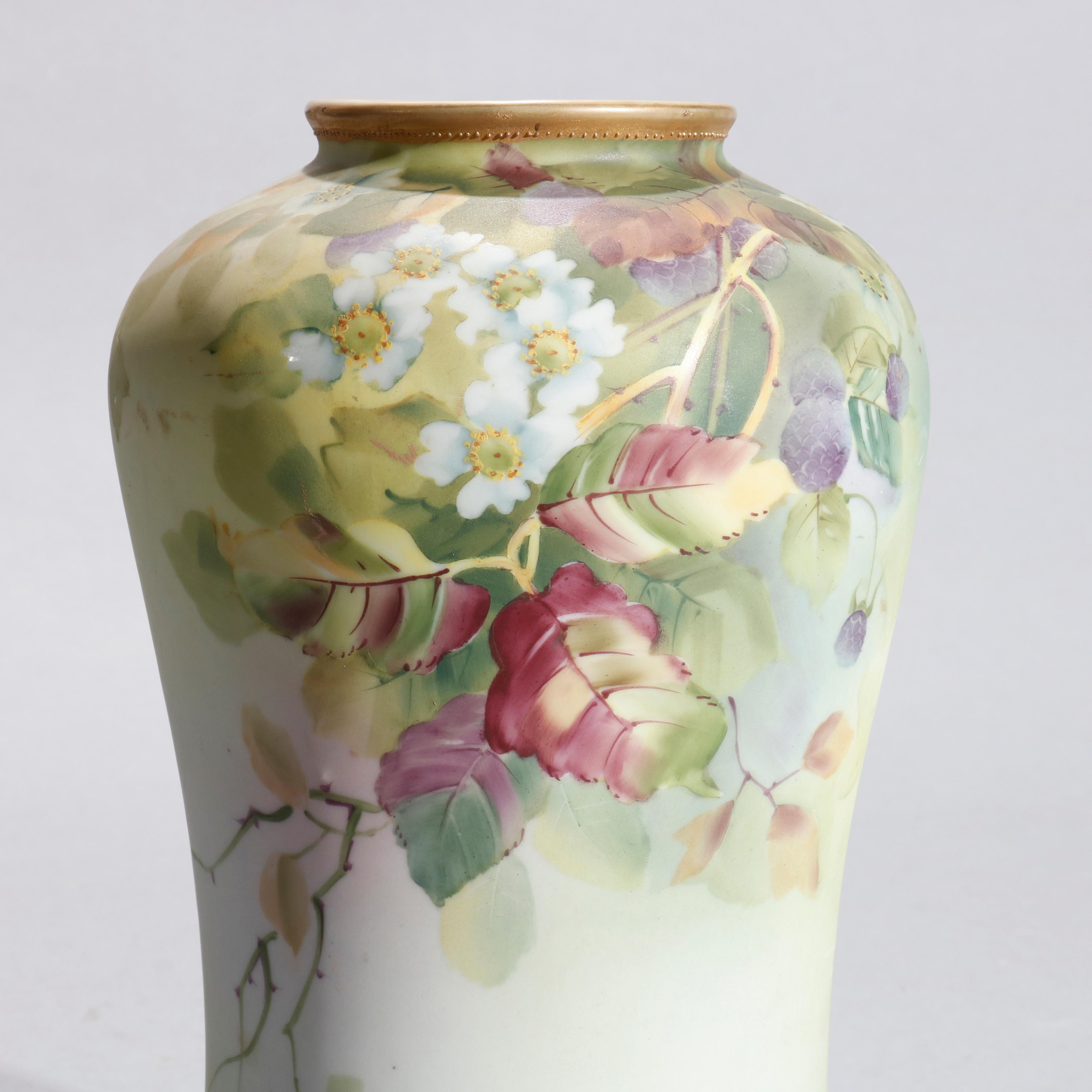 An antique Japanese Nippon porcelain vase offers hand painted floral and foliate decoration with gilt highlights, stamped on base as photographed, circa 1920

Measures- 10.25