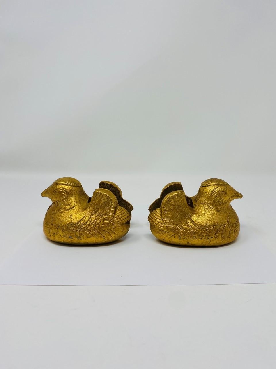Incredible pair of Japanese hand cast gilt bronze Mandarin Duck screen holders with detailed plumage, Taisho period 1920. Each of these two sculptures is in great condition with an almost intact gilt finish. Beautiful works of art that serve as