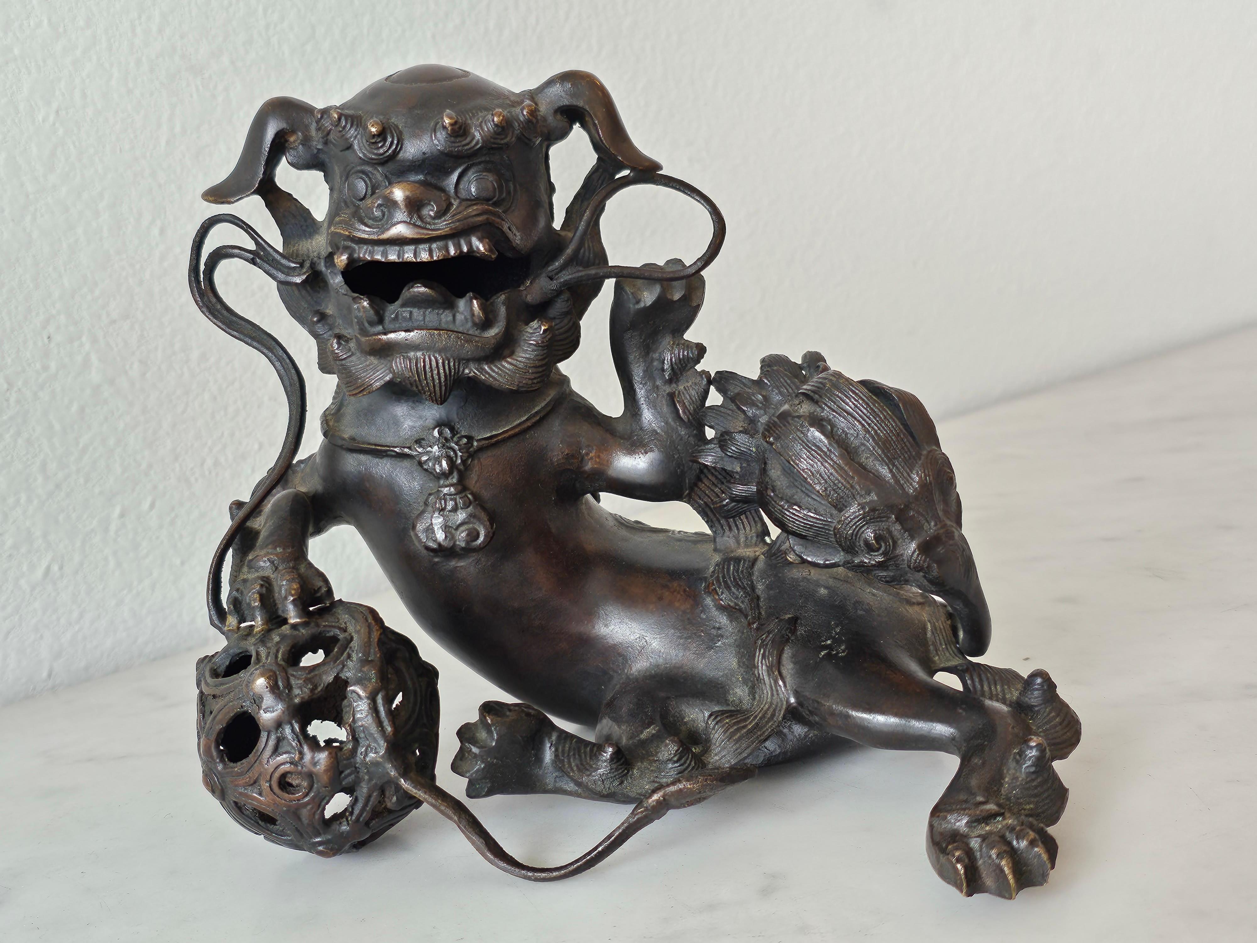 A remarkable Edo Period (1603-1868) Japanese patinated bronze Buddhistic lion censer, exceptionally executed sculptural shishi foo dog form, finely detailed, retaining the original removable cover back plate that allows burning incense to be placed