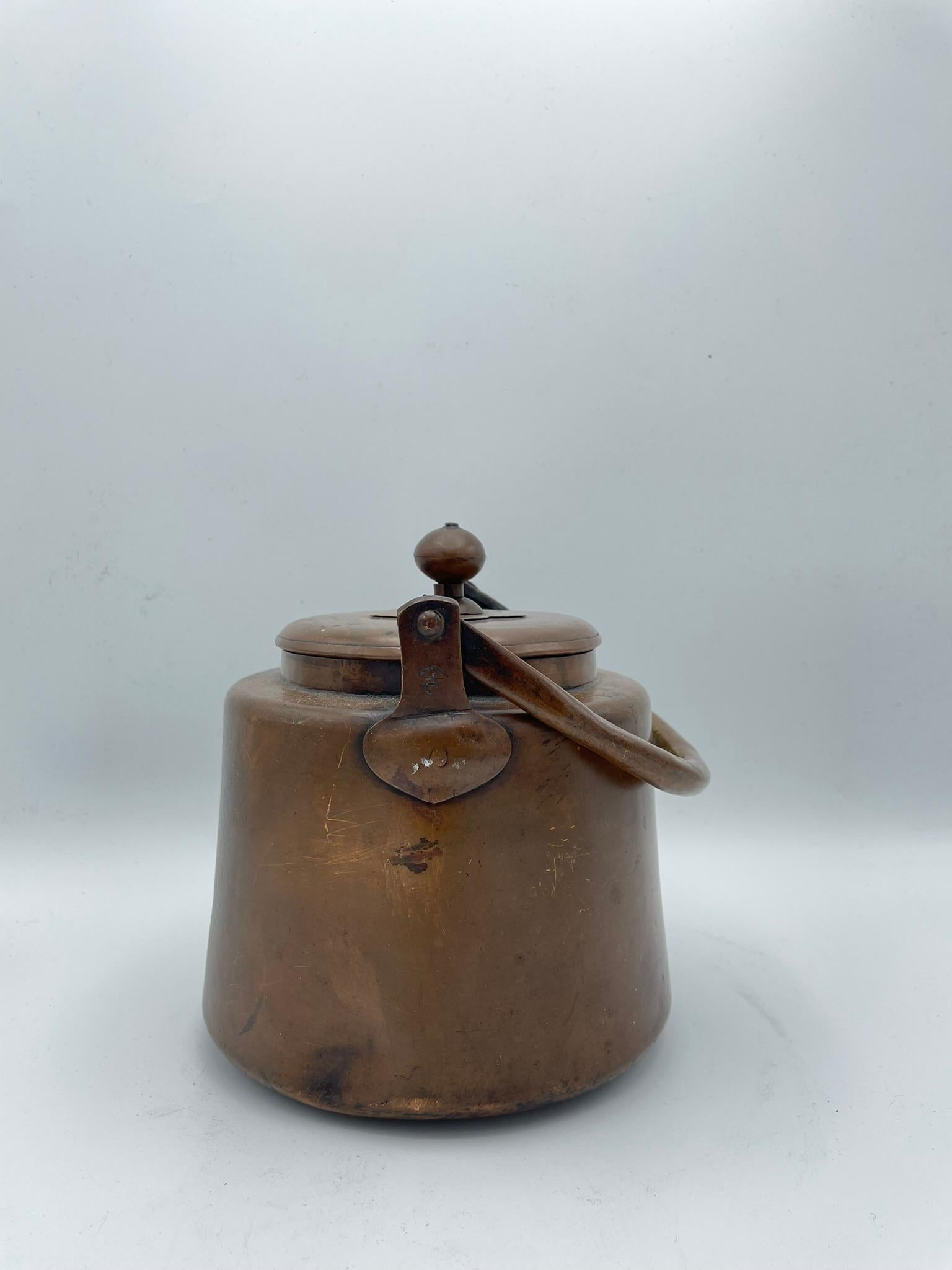 This is an antique pitcher for tea ceremony made in Japan around 1920s (Taisho era). And made with Copper. 

This kind of pitchers are called 'Mizusashi' in Japanese. A mizusashi is a tool used to hold water needed for the tea ceremony. It is used