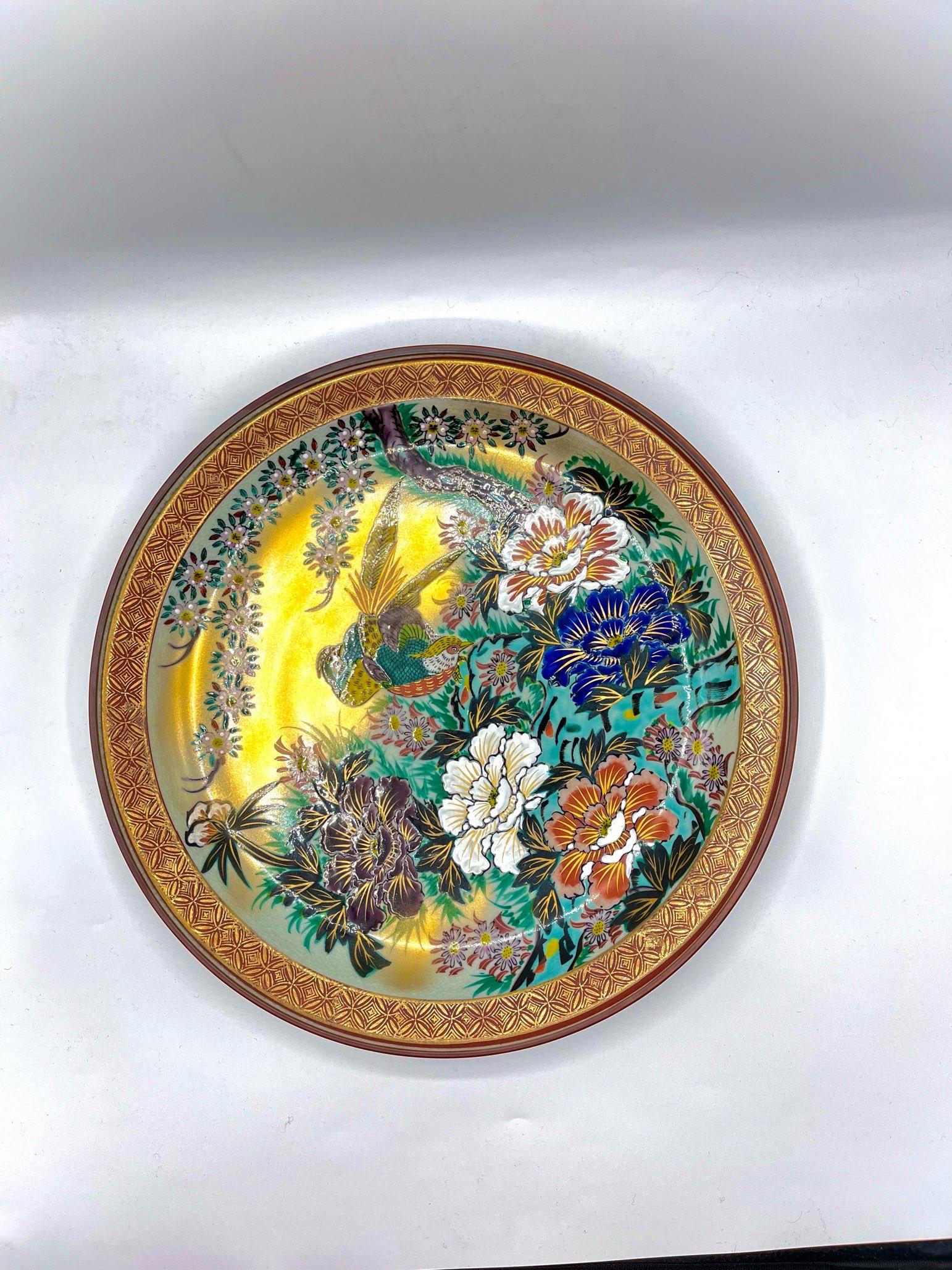 This is Kutani 1950th Century.
This plate was made with porcelain, style of kutaniyaki.
It is a traditional craft of ceramics with overglaze painting and was born in the early Edo period. Kutani ware is characterized by bright colors, bold and