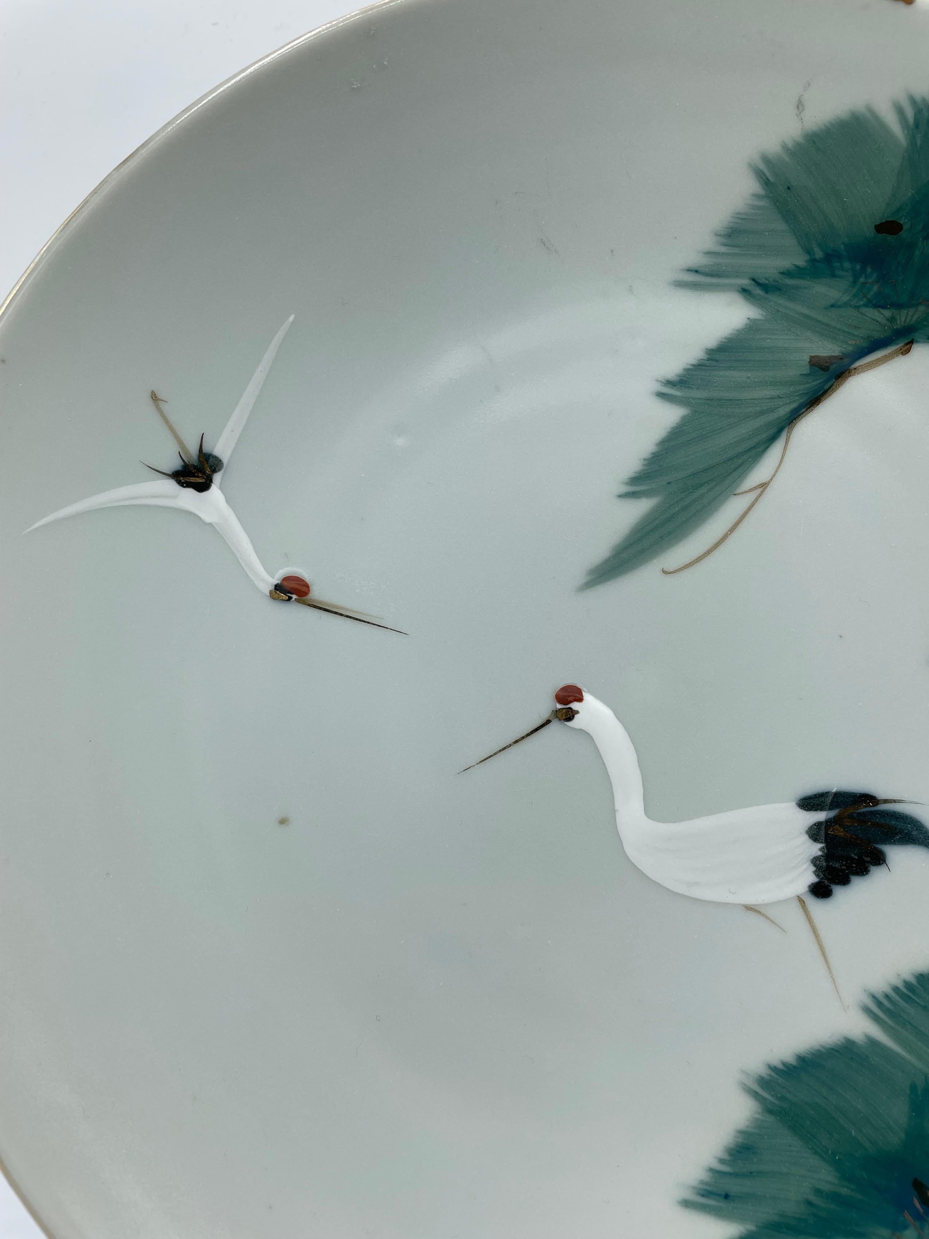 This is an antique plate which was made around 1960s in Showa era.
This plate is hand painted. It is made in Japan.
There is two cranes on this plate.
Two cranes walking or flying together is the ultimate symbol of longevity. Since cranes fly in