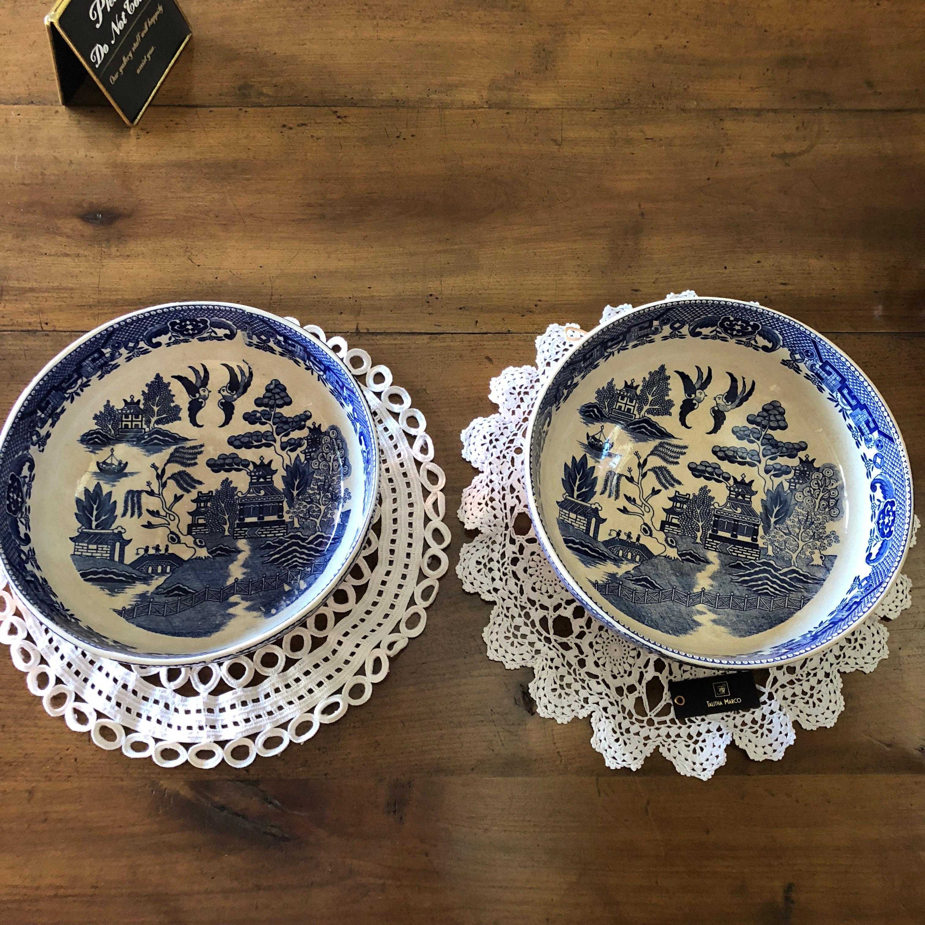 This exquisite pair of matching antique Japanese porcelain bowls, feature blue and white hand painted traditional willow scenes with delicate traditional Japanese geometric bordering. A beautiful pair of Japanese, collectable porcelain that remain